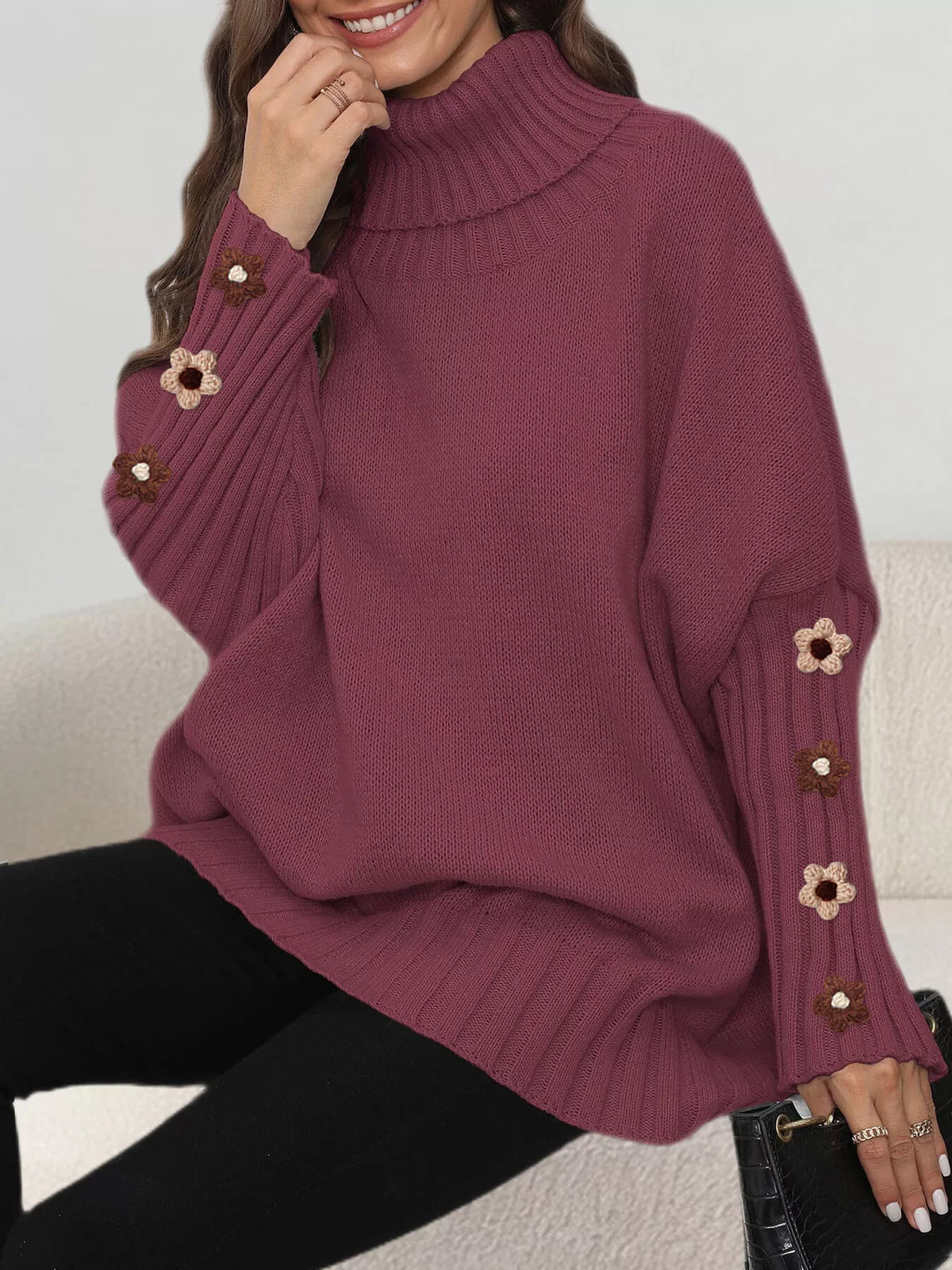 Burgundy oversized floral sleeve turtleneck sweater, seated view