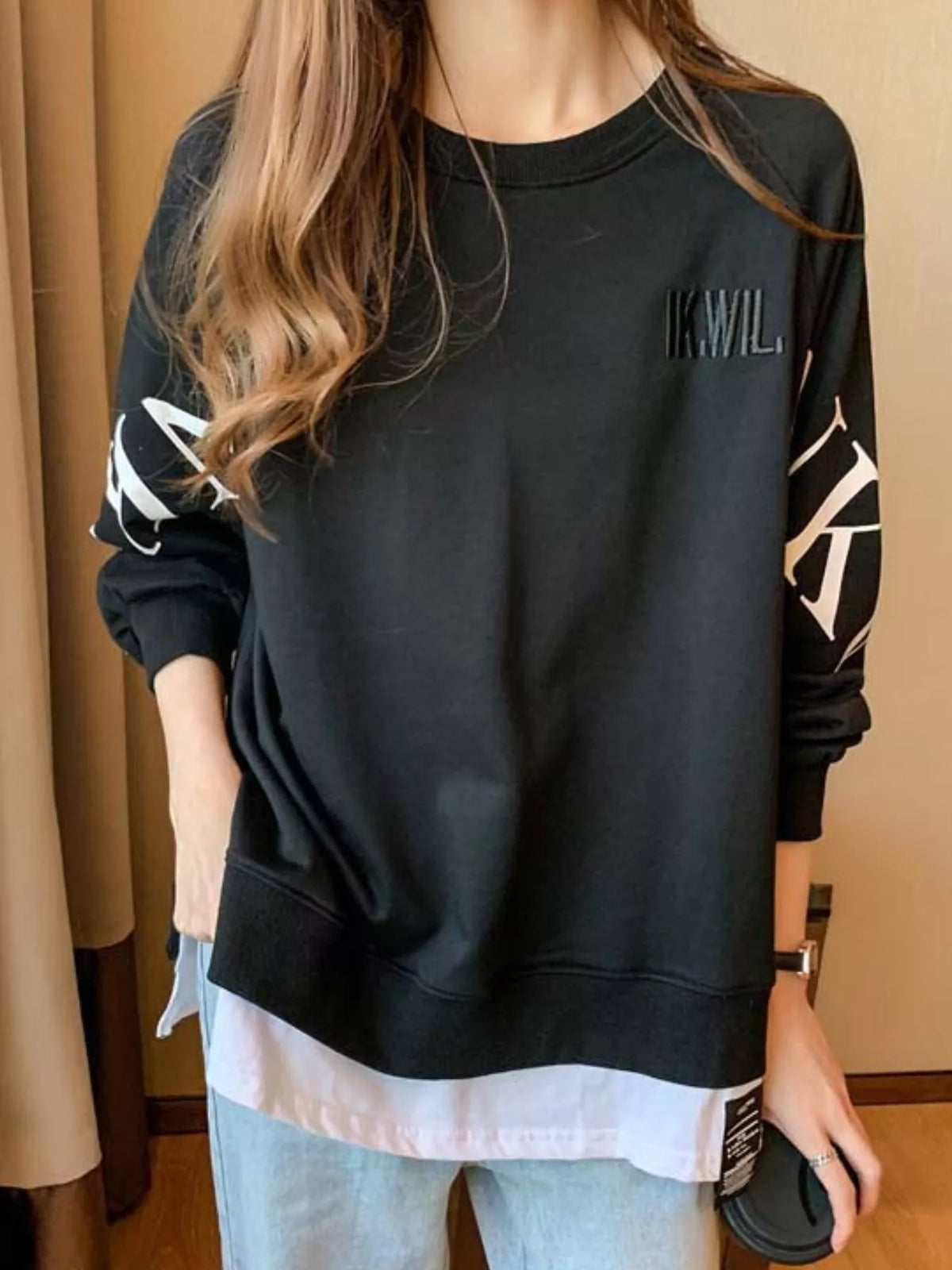 Black layered-hem sweatshirt with graphic sleeve detail