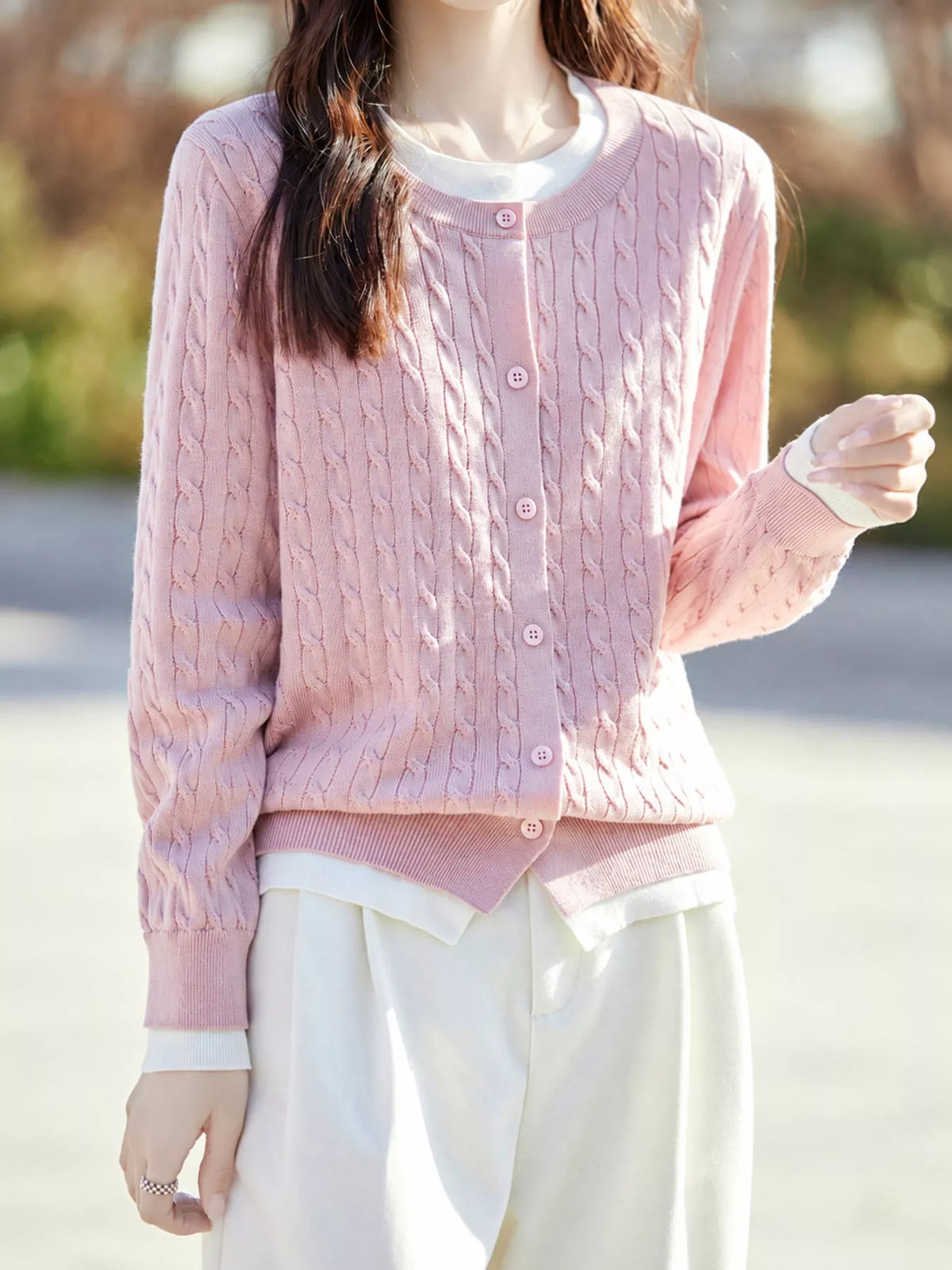 Pink cable-knit button-down cardigan