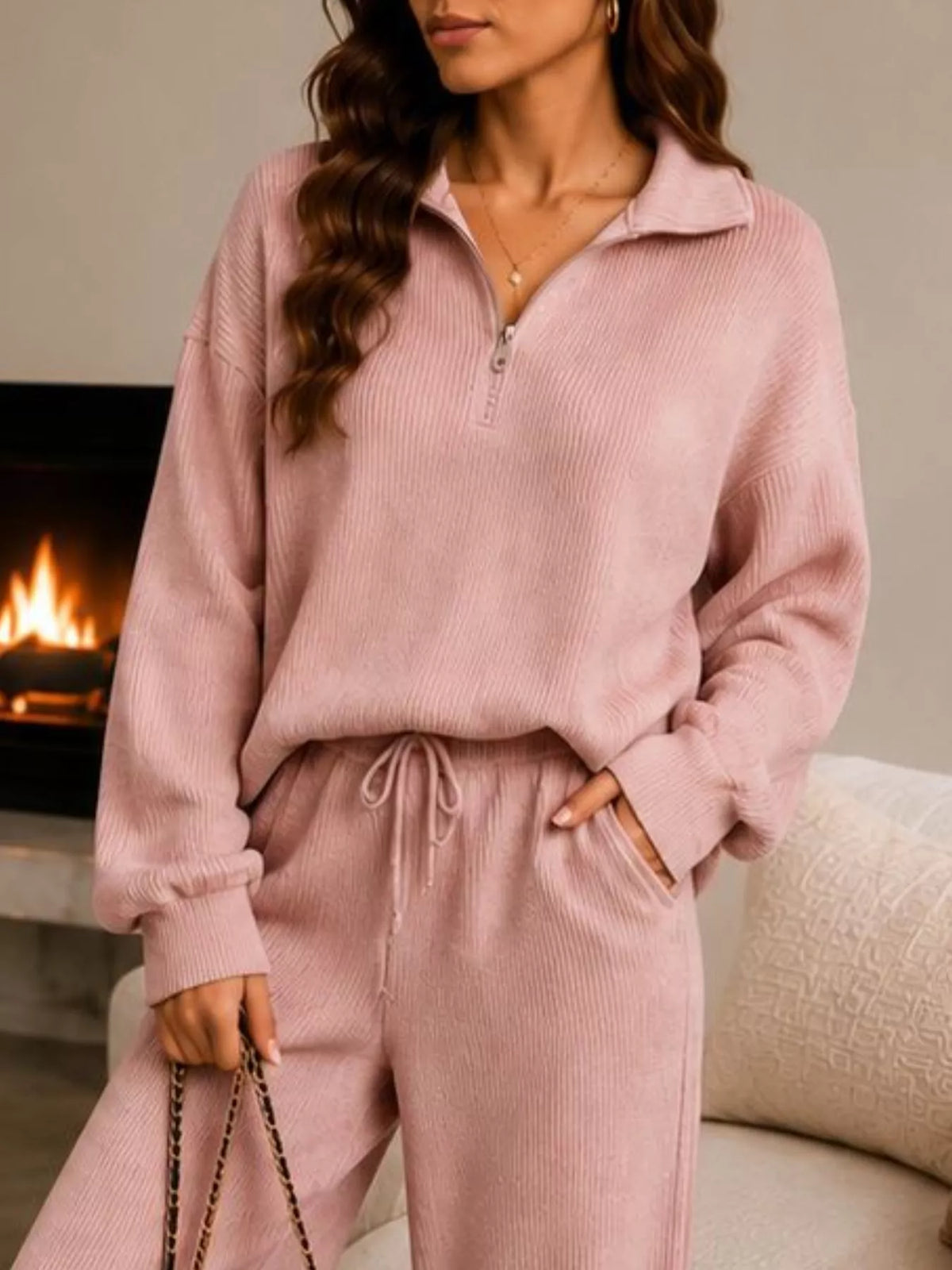 Pink quarter-zip knit top and pants set, zip neckline and waist detail