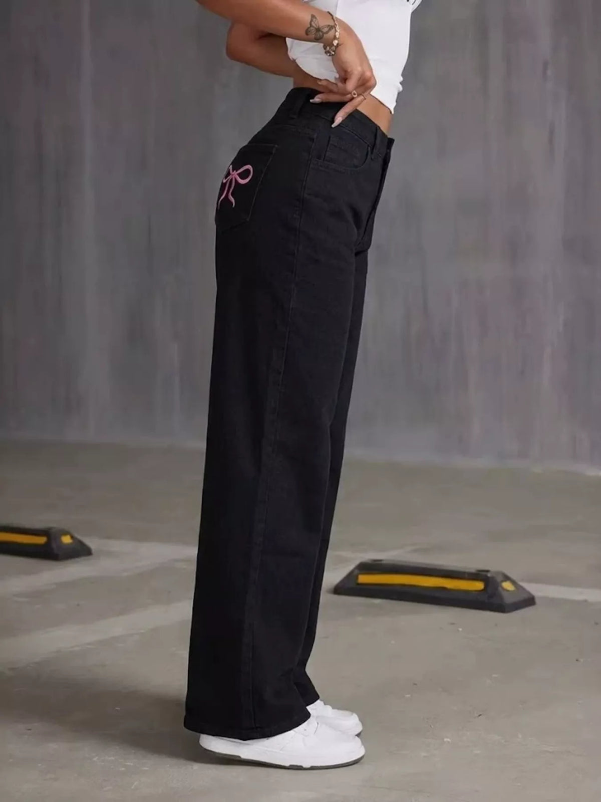 High-Waisted Bow Detail Wide-Leg Jeans in black, side view