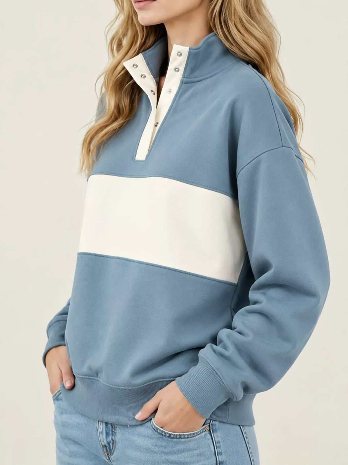 Blue and cream color block snap-button sweatshirt, side view