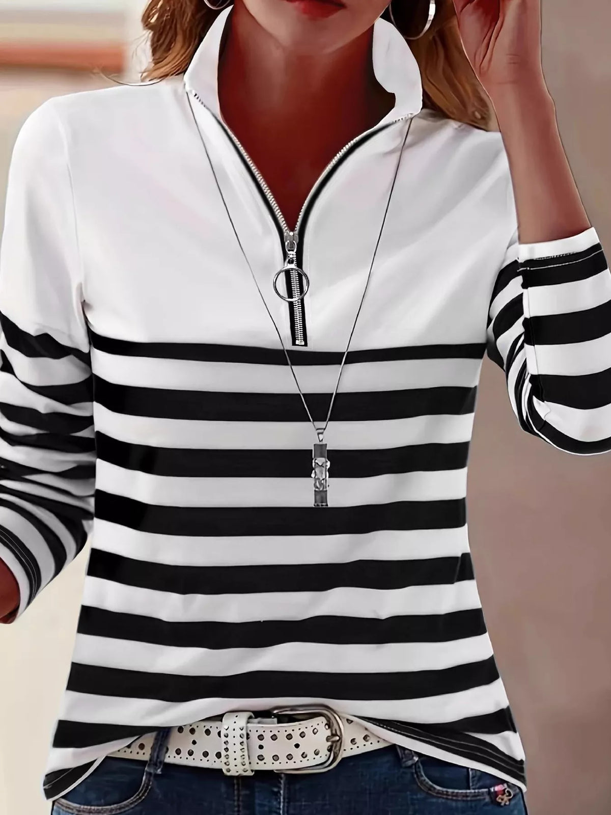 Black and white quarter-zip striped top, front view