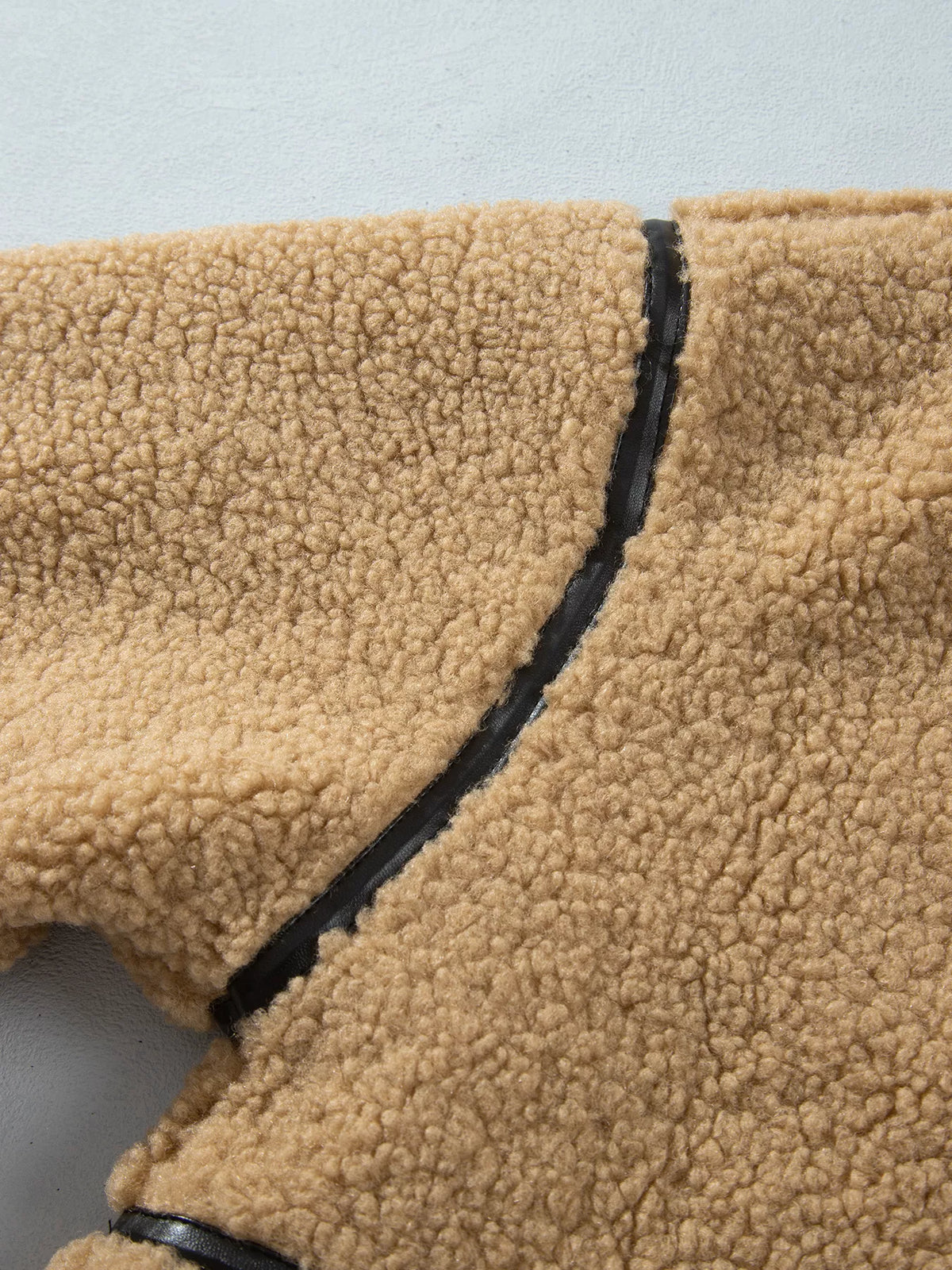 Camel fleece zip-front jacket with contrasting seam trim, shoulder seam detail