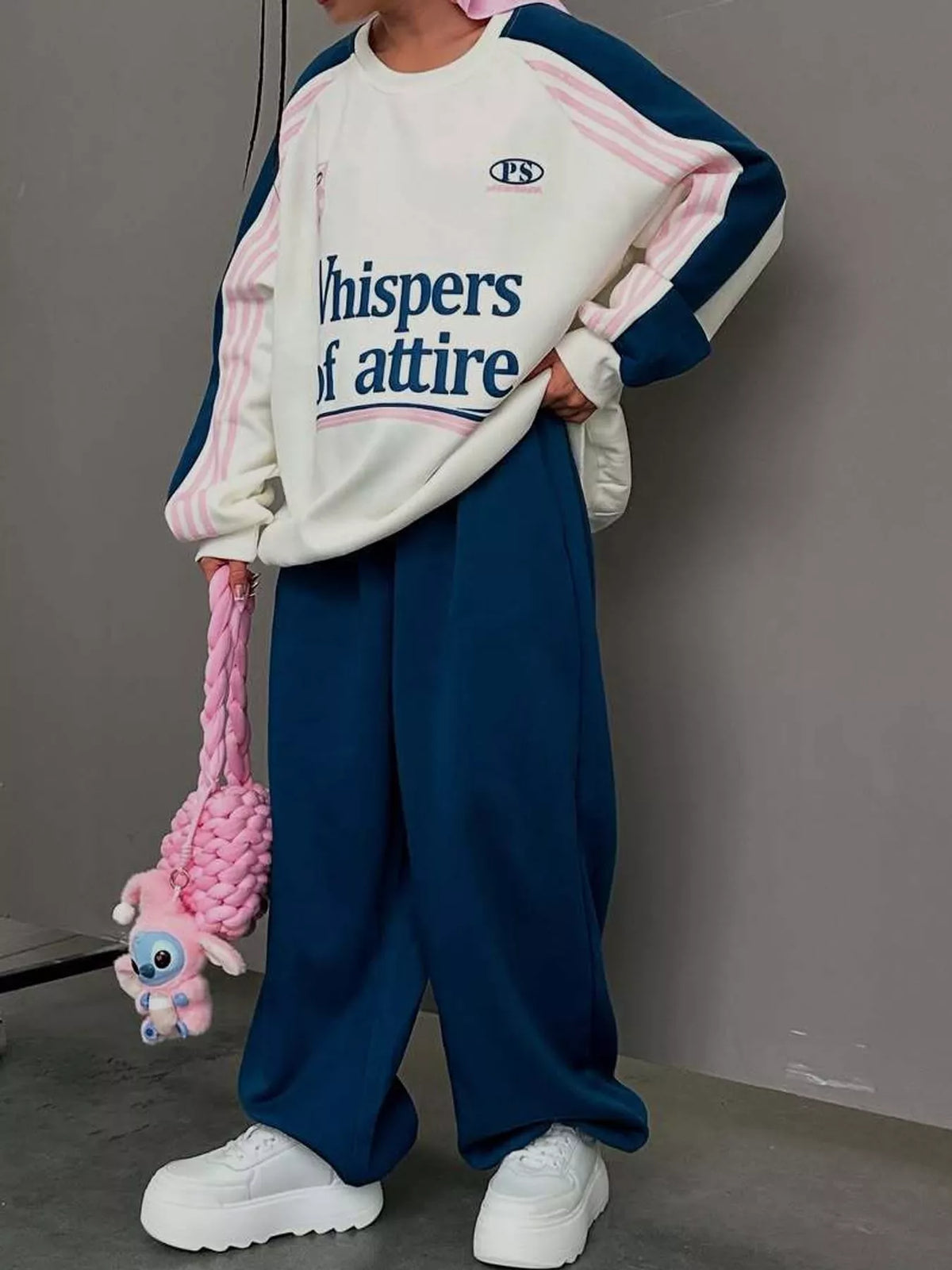 Cream top and navy pants color-block sweatshirt and wide-leg pants set — front view