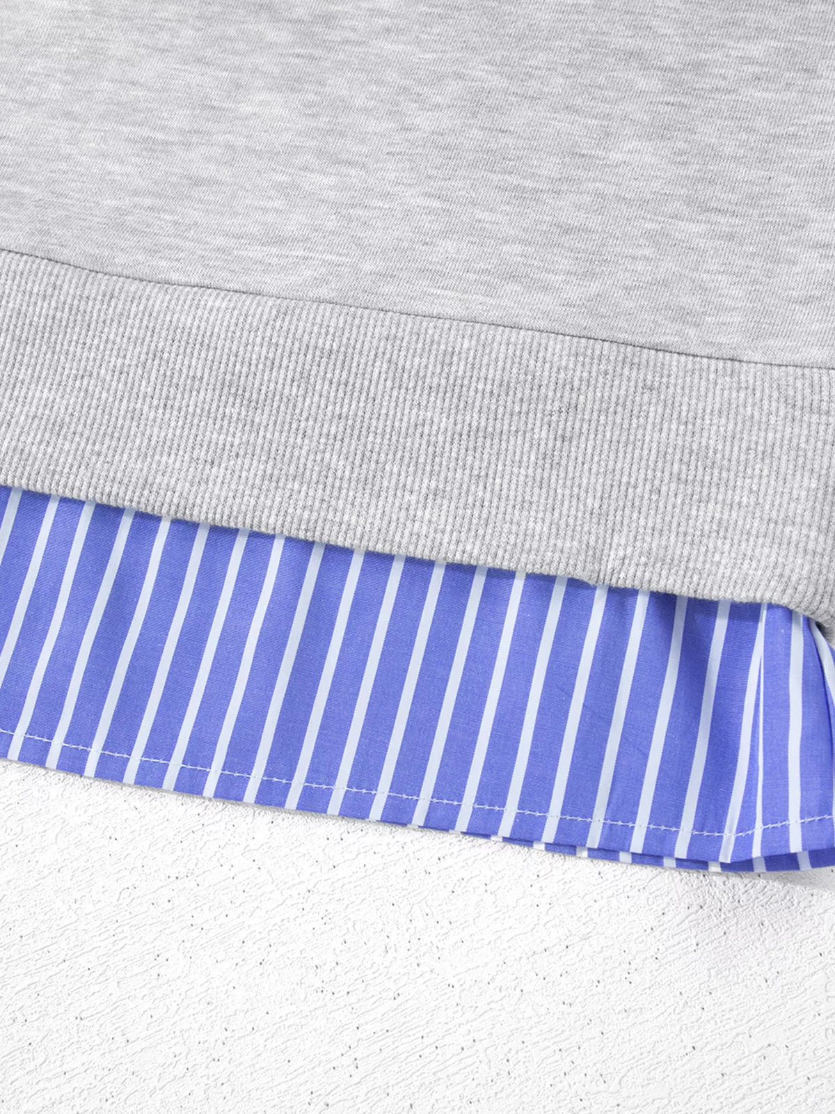 Striped-collar sweatshirt, striped hem close up