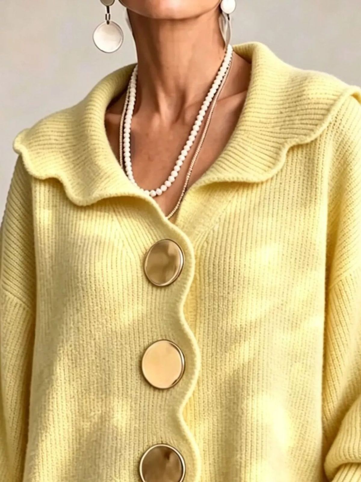 Pastel yellow scalloped-edge knit cardigan, collar detail