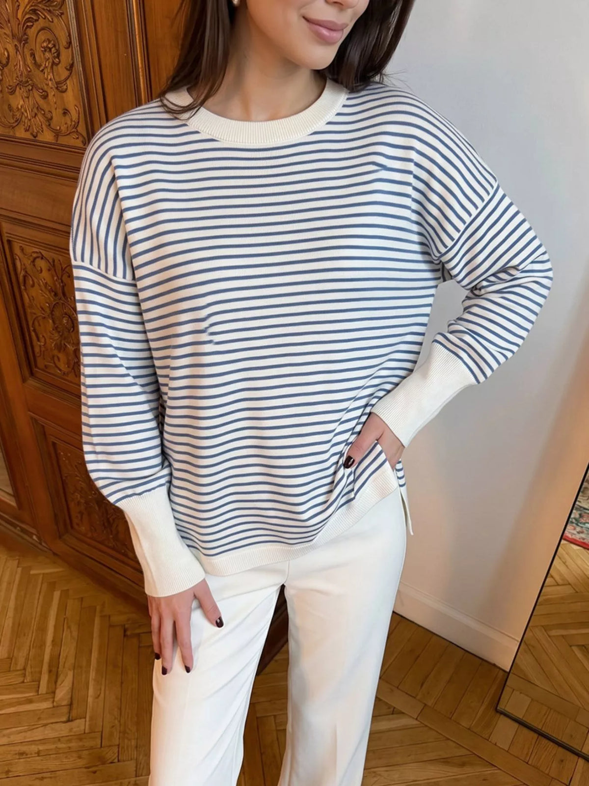 Striped round-neck knit top in white and blue, front view on model