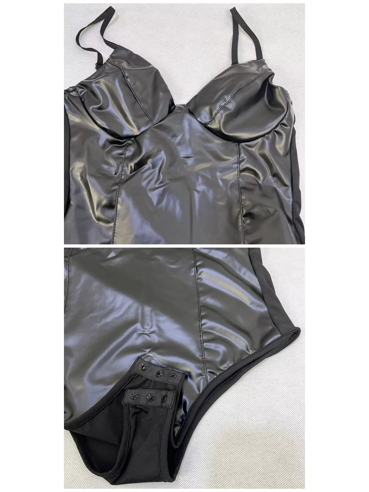 Black faux leather bodysuit, flat front view showing straps, bust seams, and snap closure
