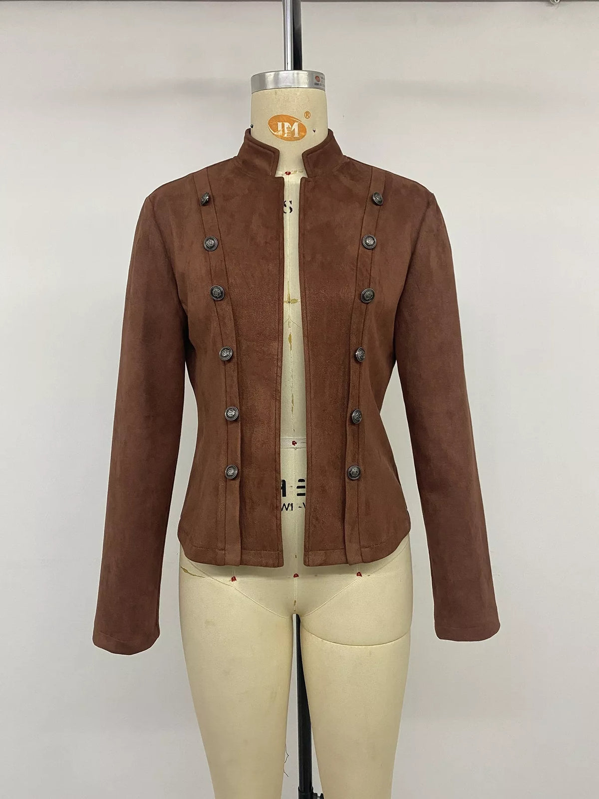 Brown stand collar cropped jacket with decorative buttons, front on mannequin