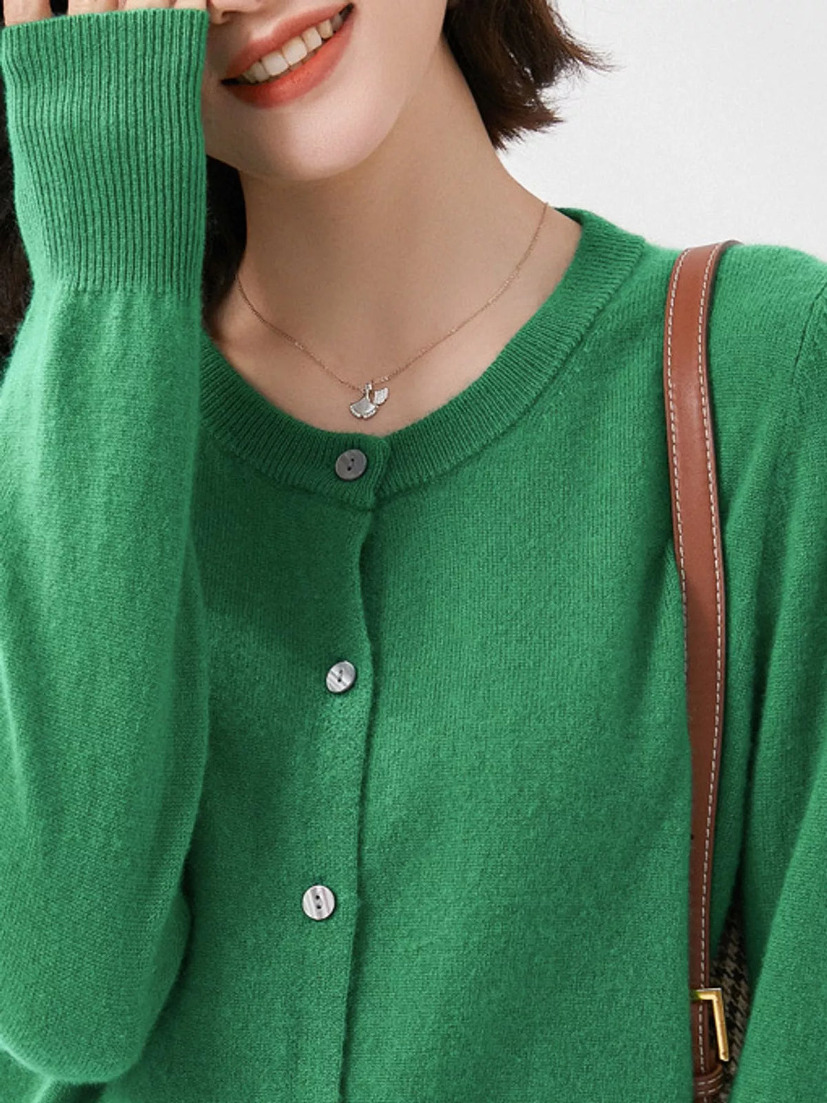 Green crew neck button-front cardigan, neckline detail