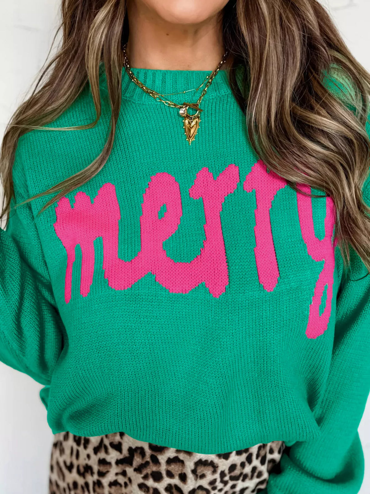 Merry sweater, green lettering close-up