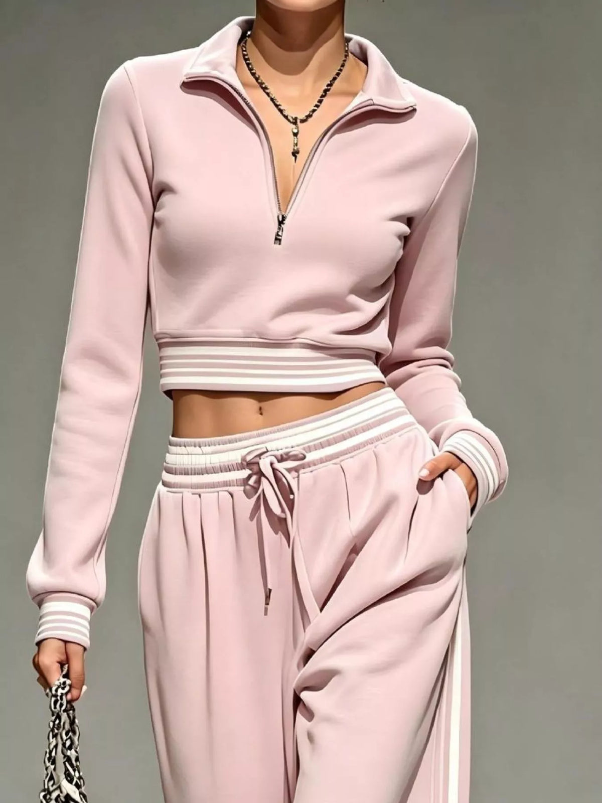 Pink half-zip crop top and pants set, zip neckline and waist detail