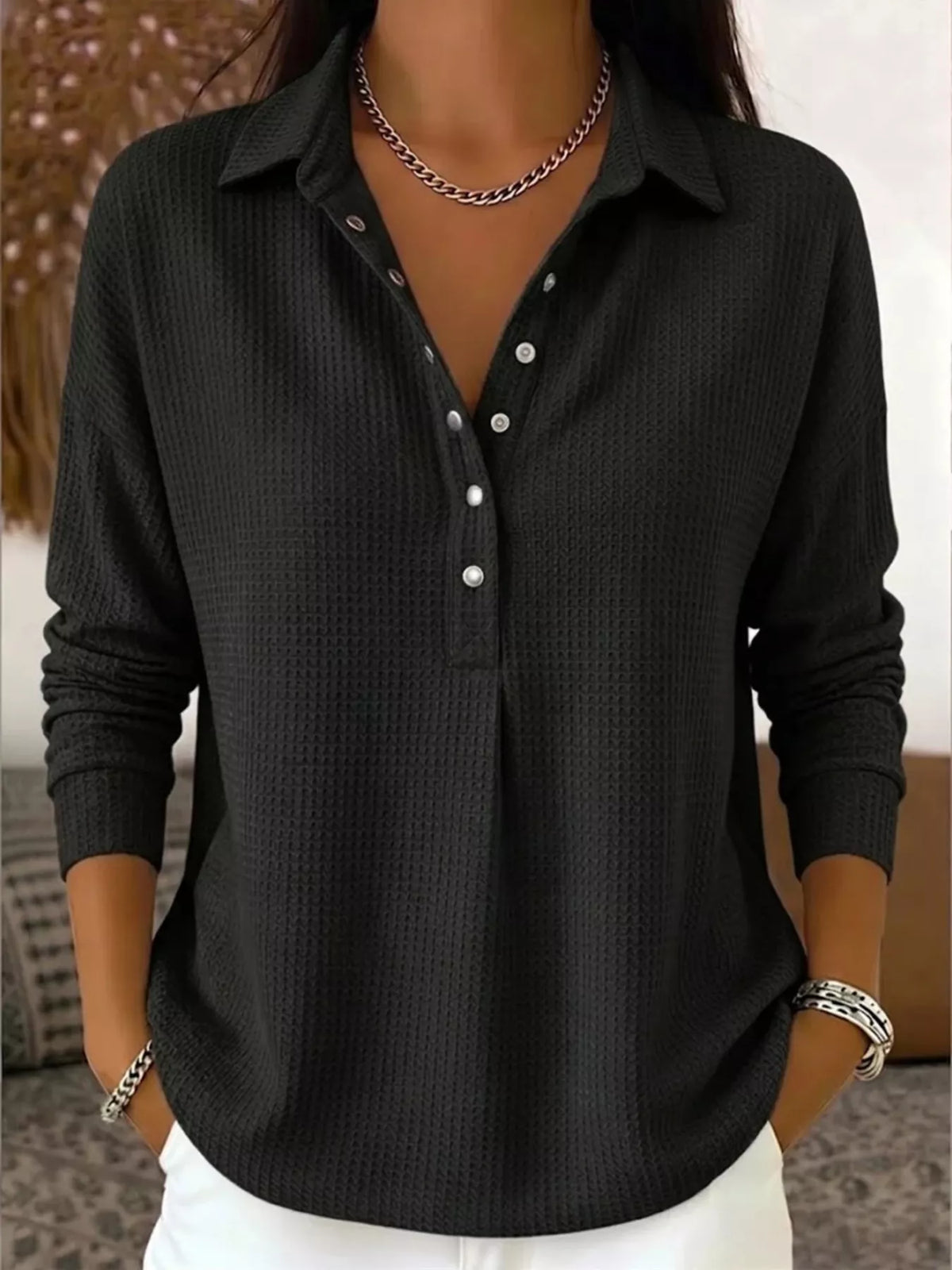 Black waffle knit snap-front blouse