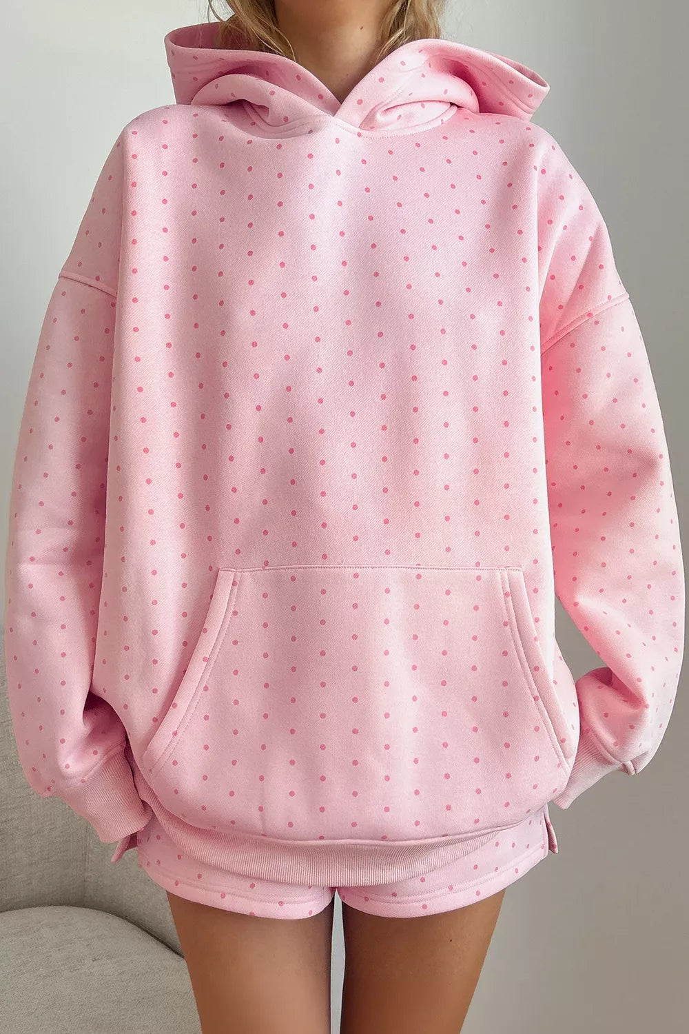 Pink polka dot oversized hoodie and shorts set — front view