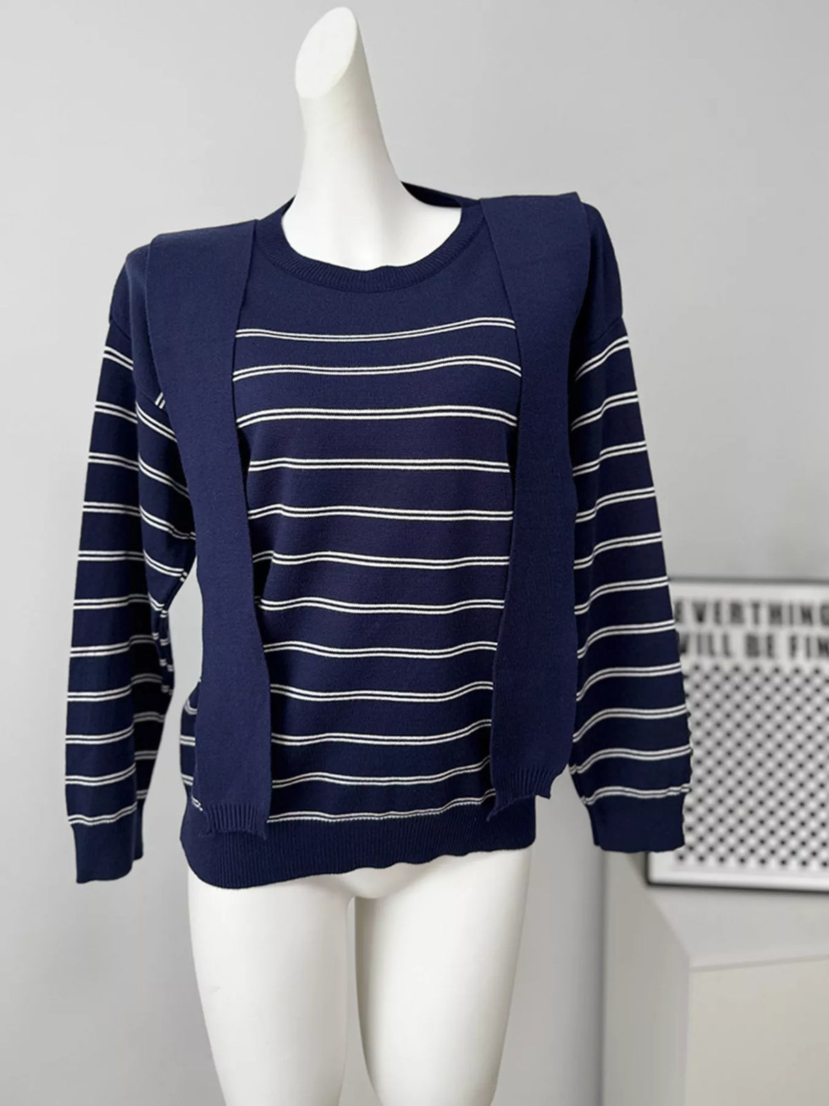 Striped crewneck sweater with layered tie detail in navy, front mannequin view with loose ties
