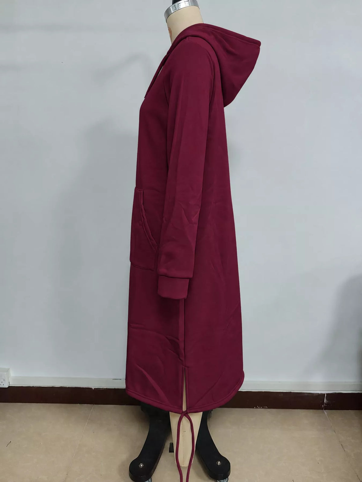 Burgundy hooded sweatshirt midi dress with drawstring hem, side view