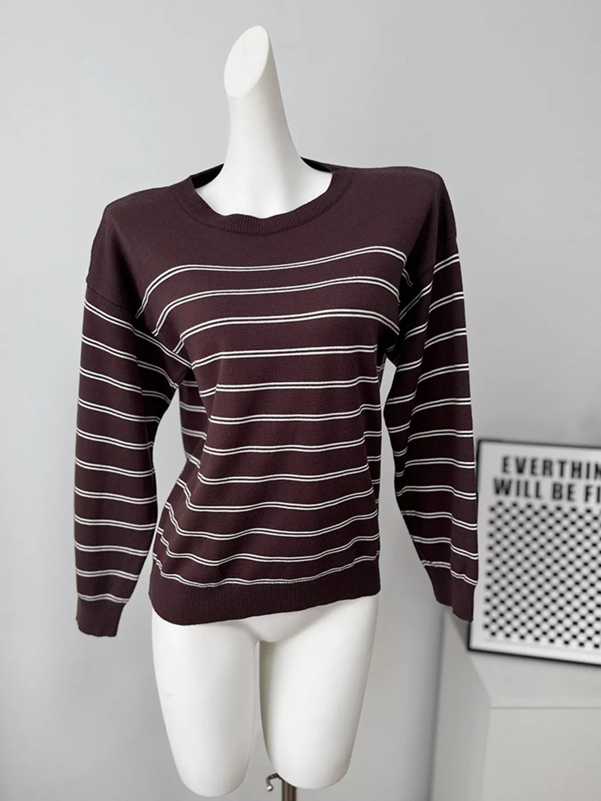 Striped crewneck sweater with layered tie detail in brown, front mannequin view without ties