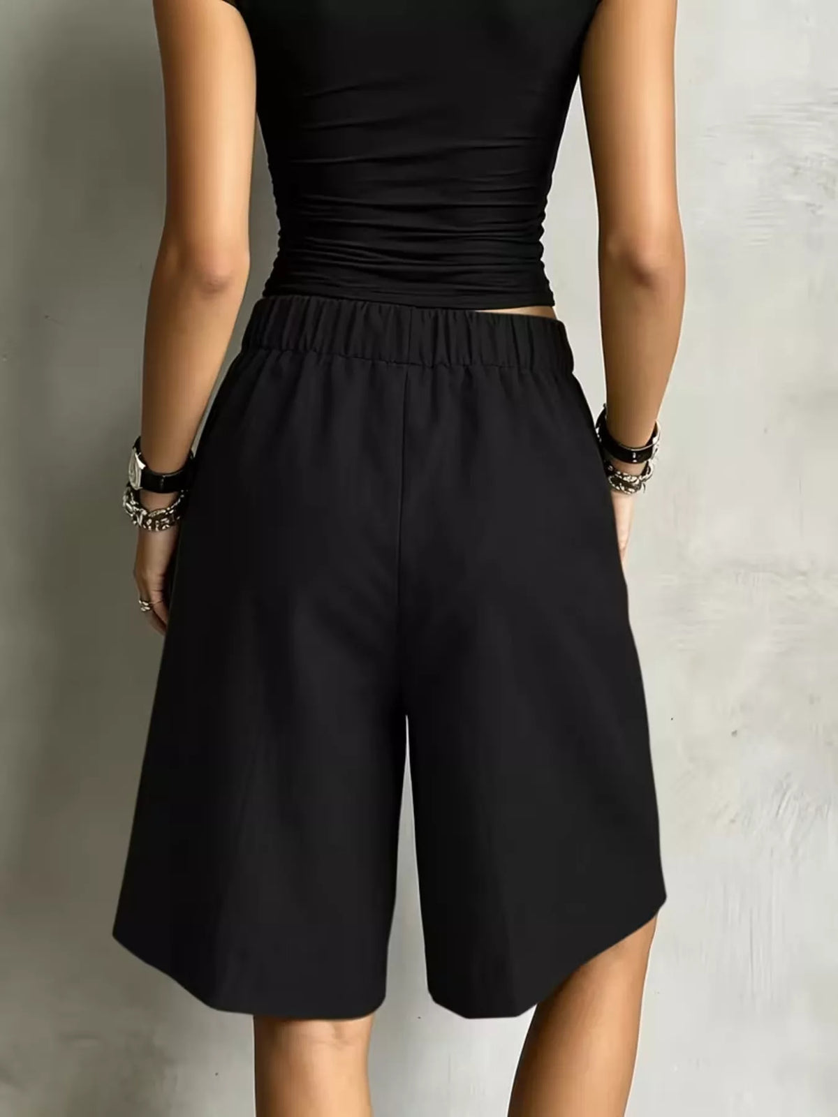 Black drawstring shorts, back view