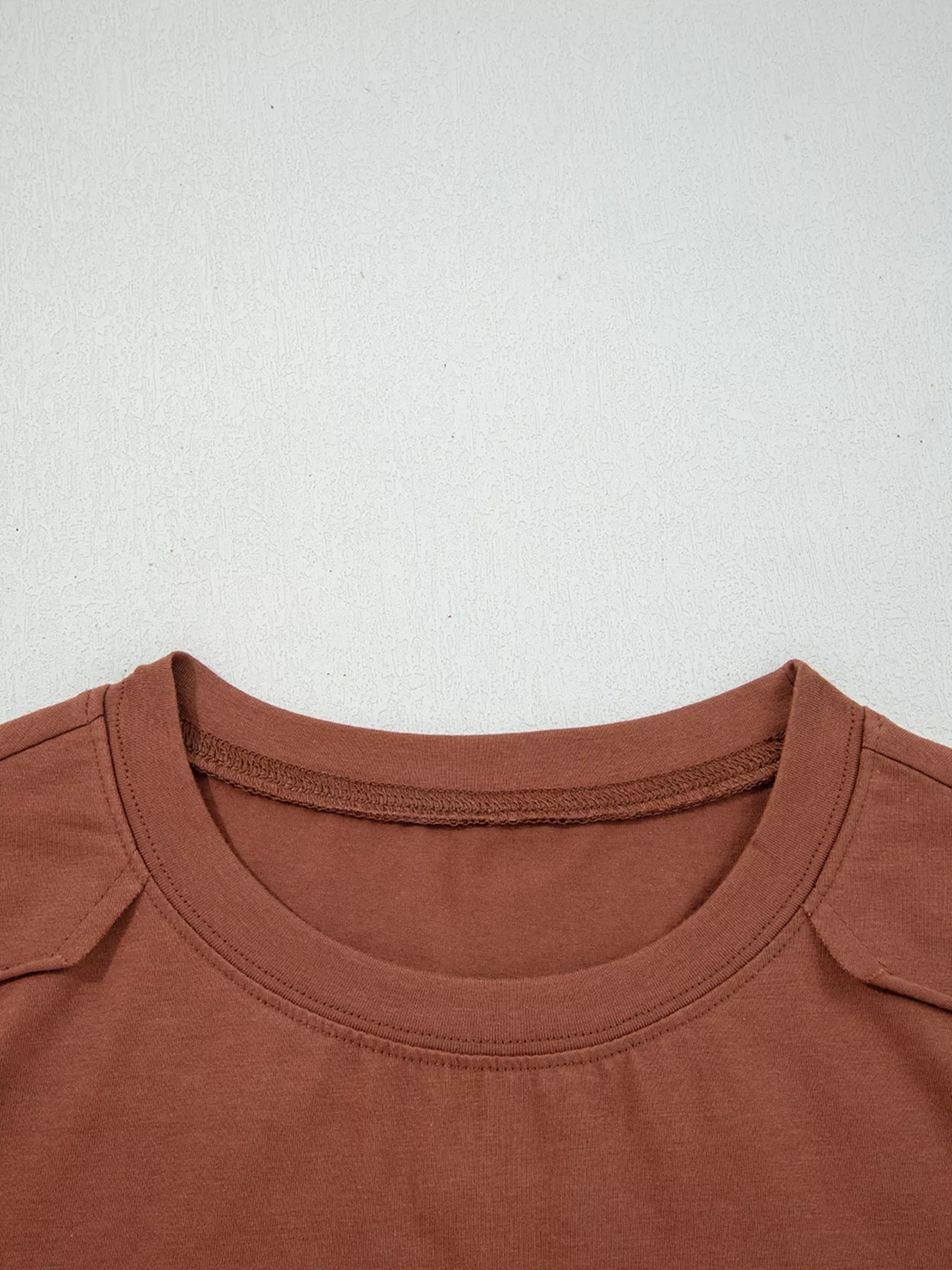 Trendsi Raw Seam Detail Solid Color Long Sleeve Top -