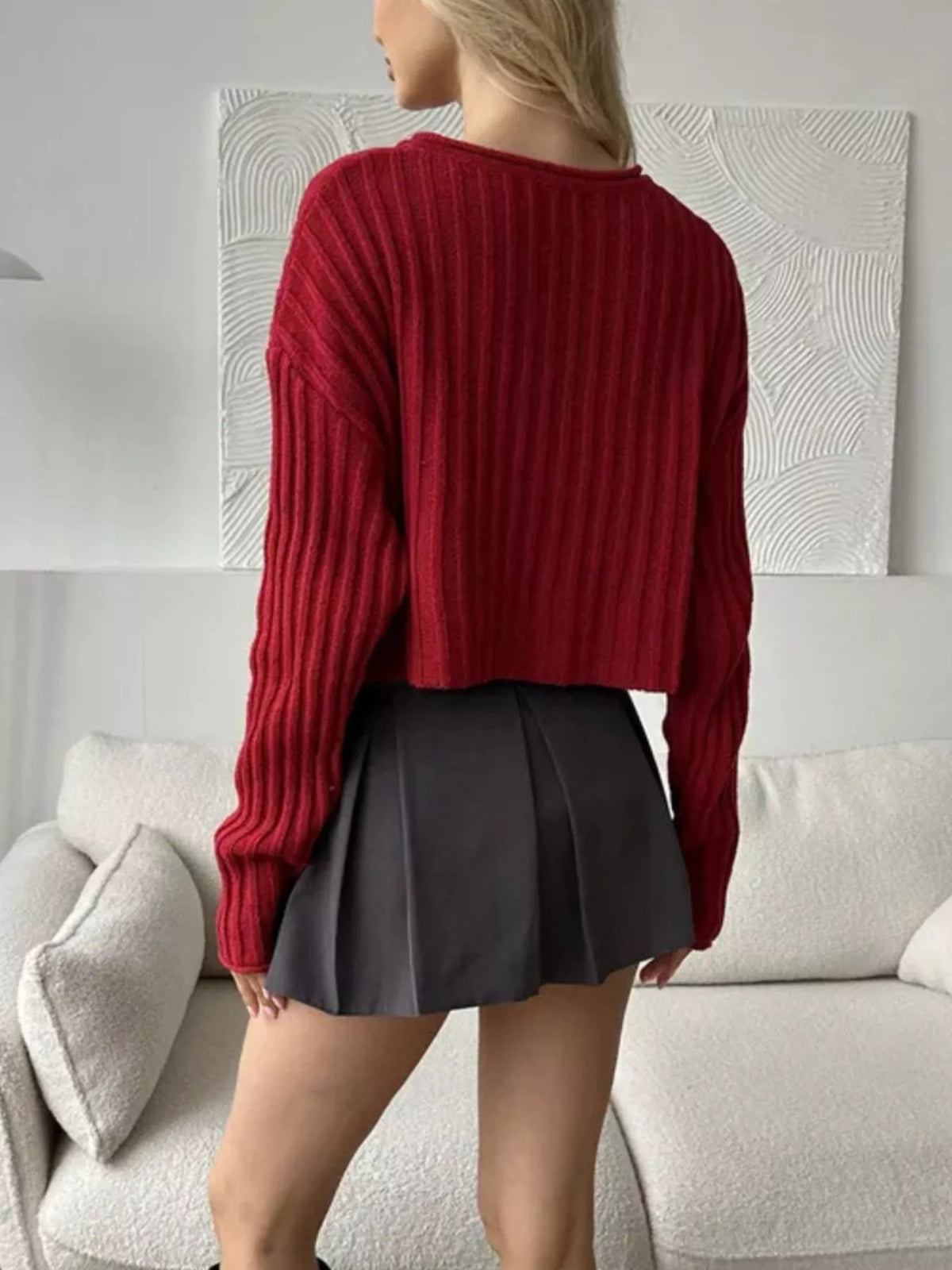 Red ribbed lace-up cropped sweater, back view.