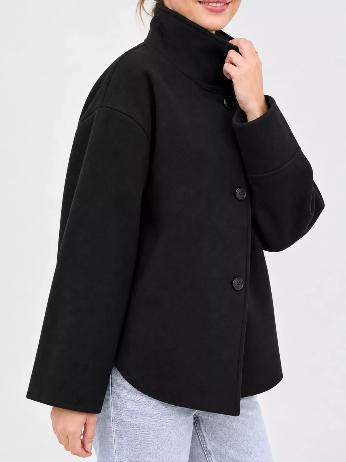 Black stand-collar button-up jacket, back view