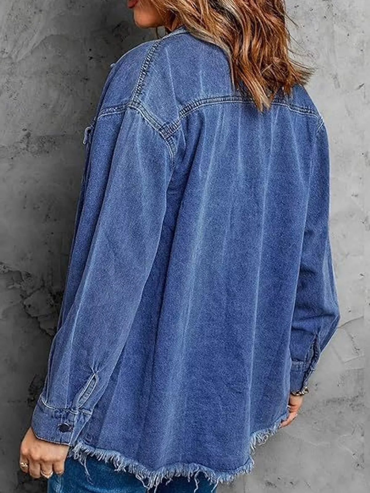 Blue raw hem button-up denim jacket — back view