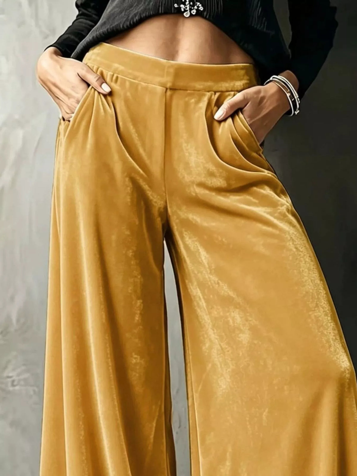 Gold wide-leg velvet pants, waist and pocket detail