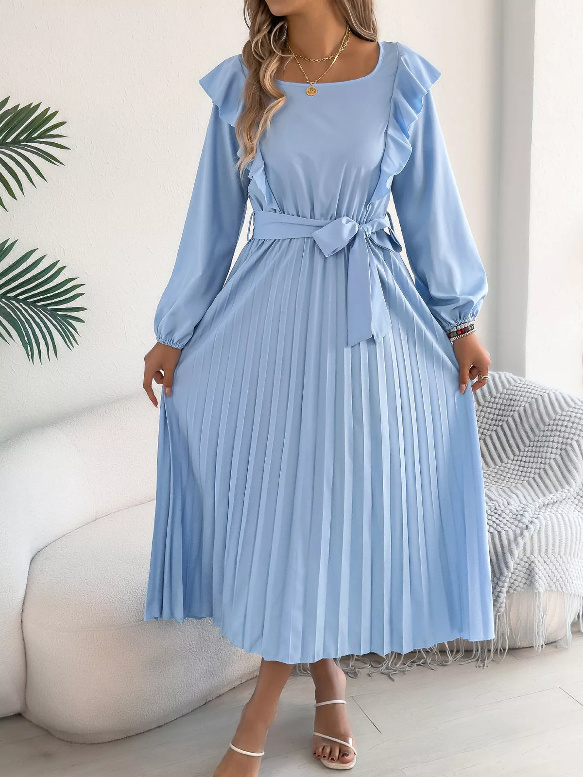 Blue ruffled pleated tie-waist midi dress, front showing pleated skirt.