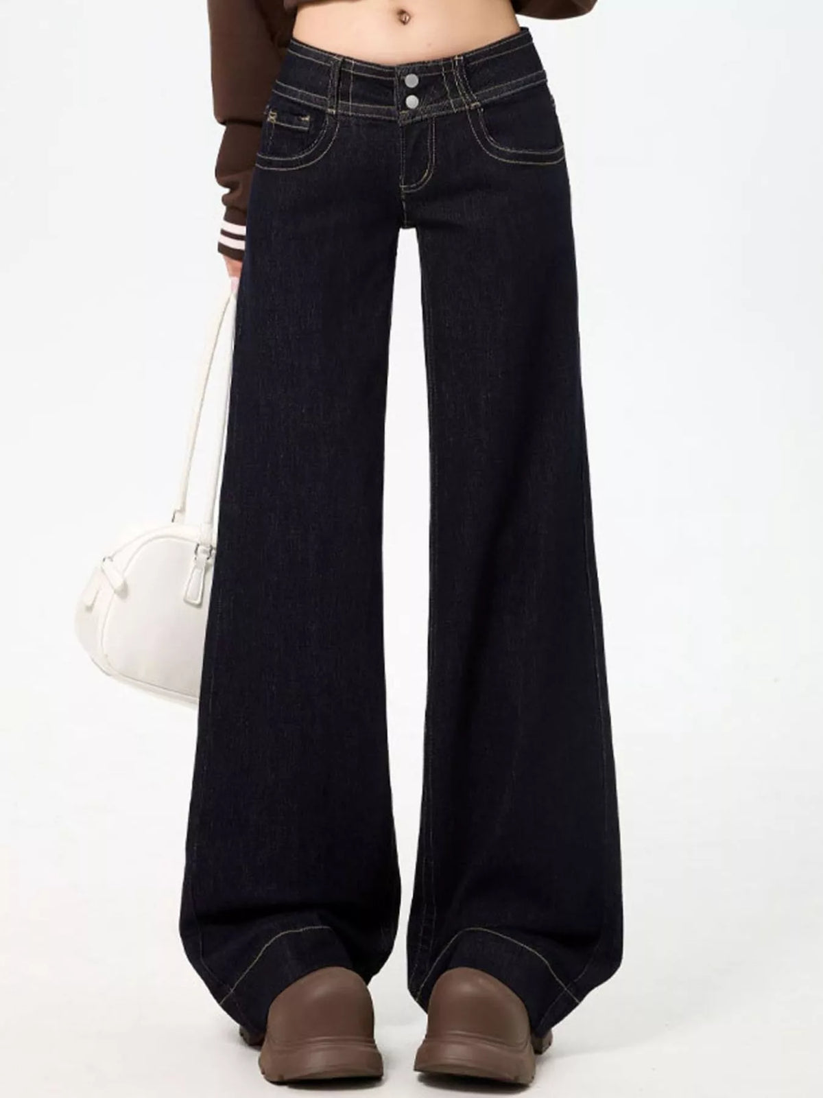 Black low-rise wide-leg jeans — front view