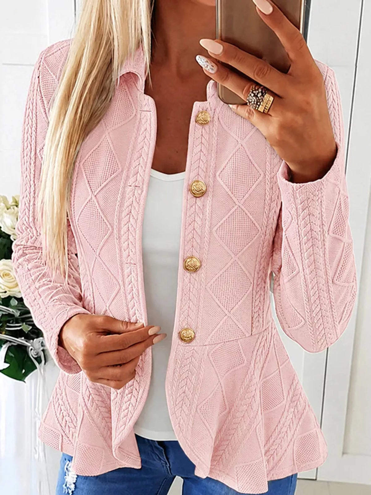 Pink cable-knit button-up cardigan — front view