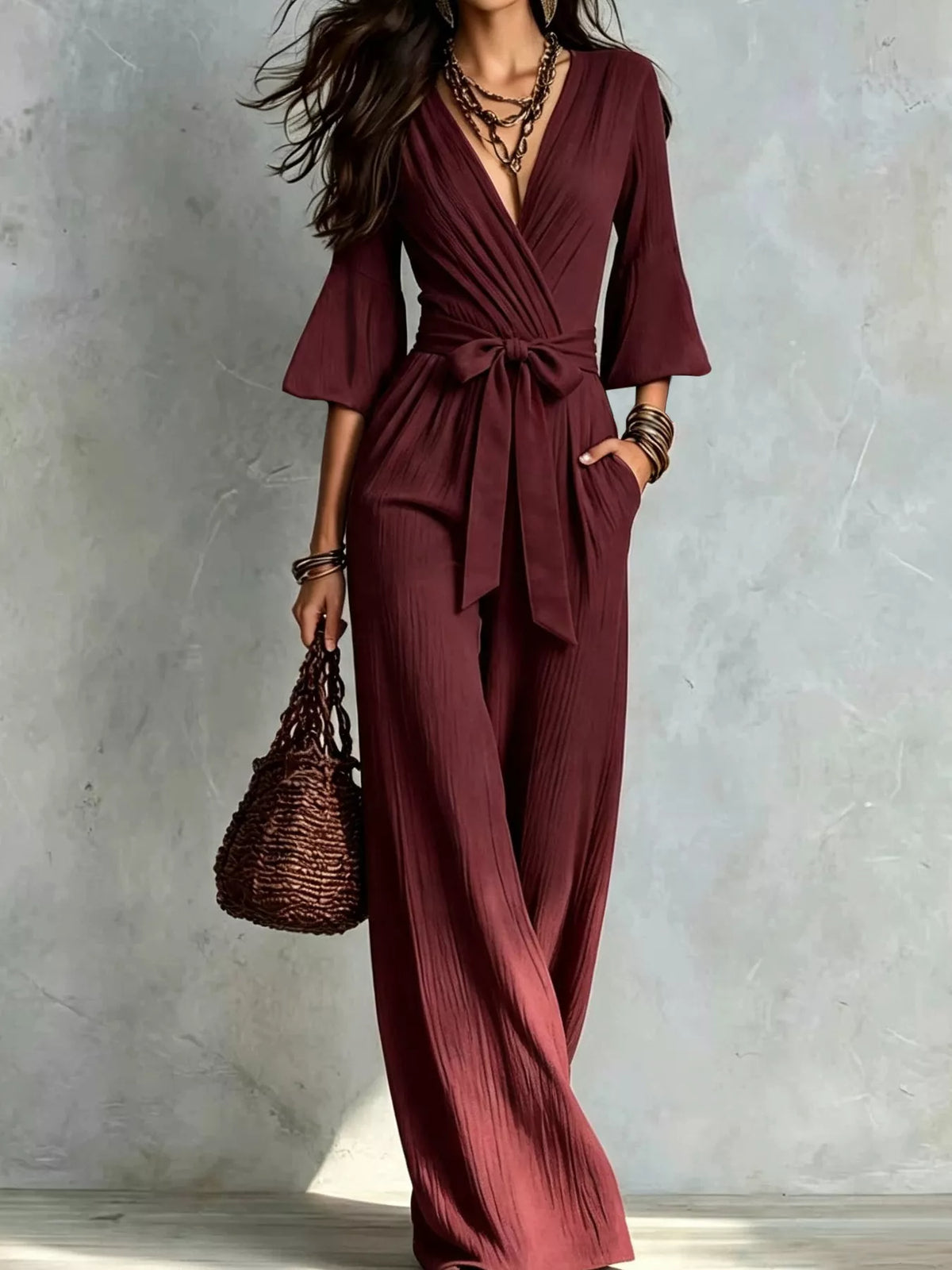 Burgundy pleated wide-leg jumpsuit with tie-waist
