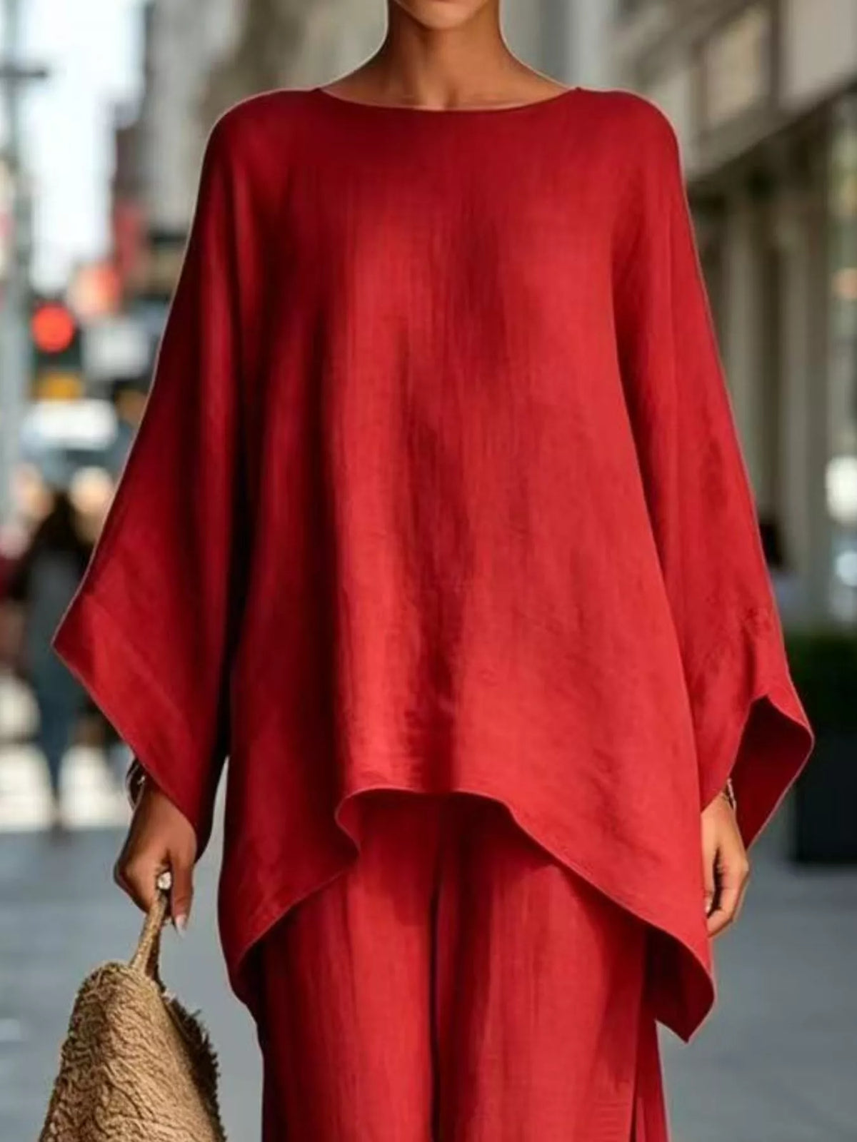 Red batwing top, neckline and hem view