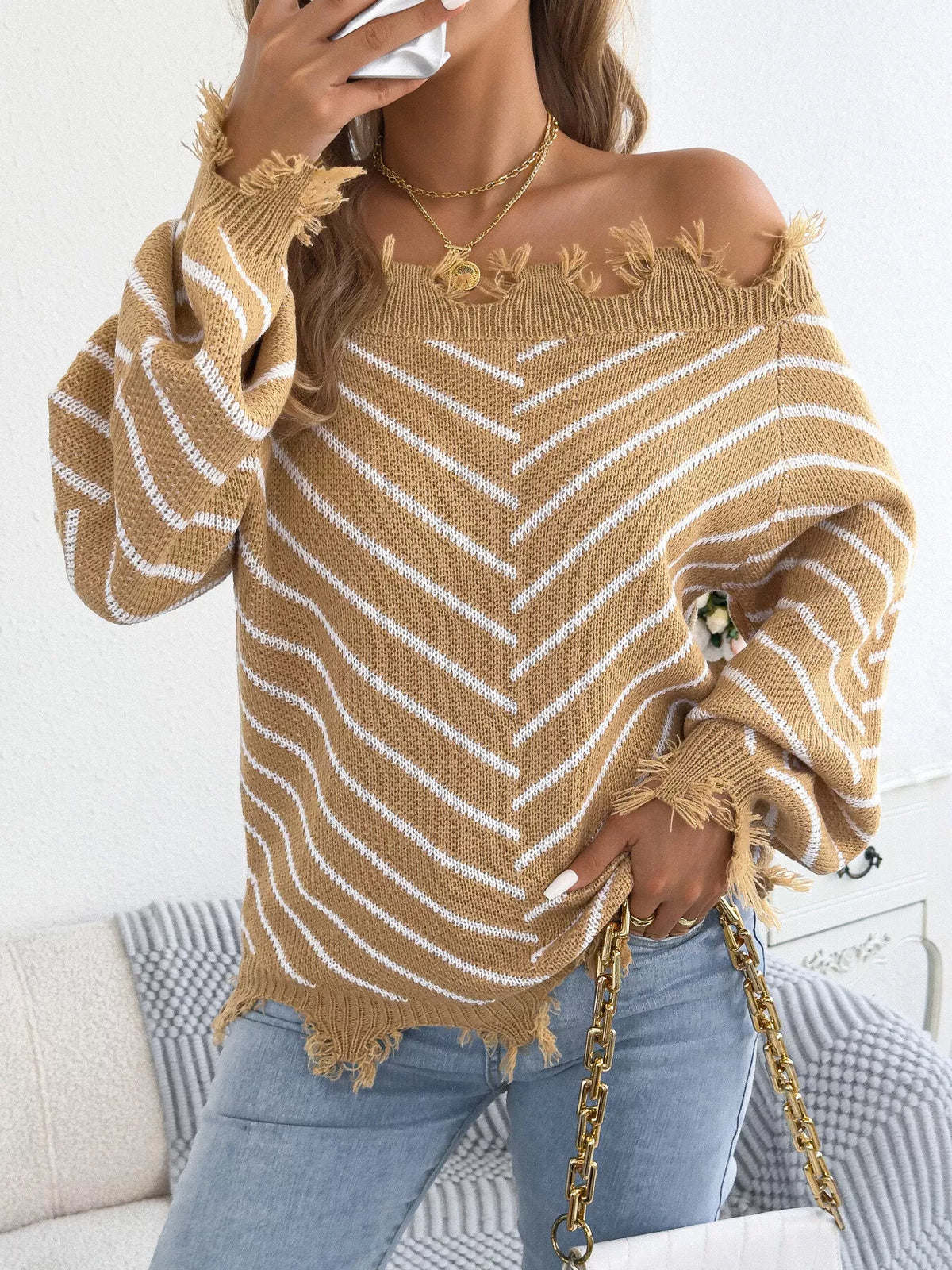 Khaki off-shoulder distressed striped sweater