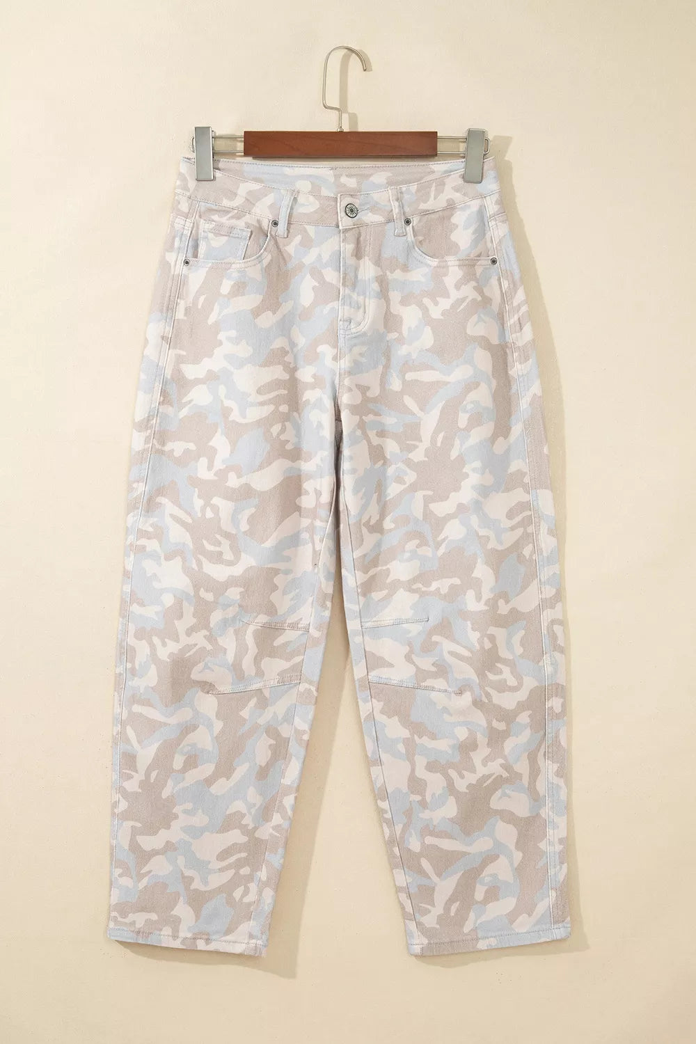 Beige camouflage barrel jeans, front on hanger