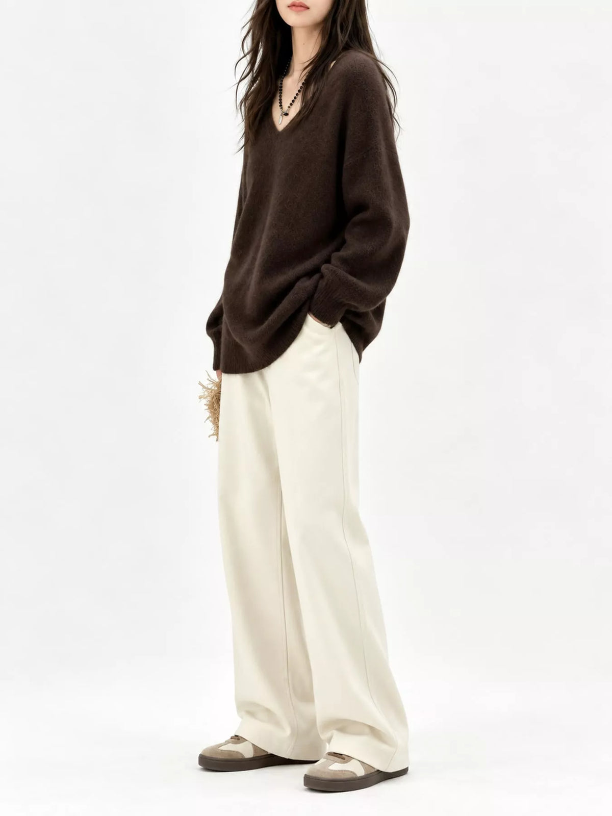 Brown v-neck sweater, side view