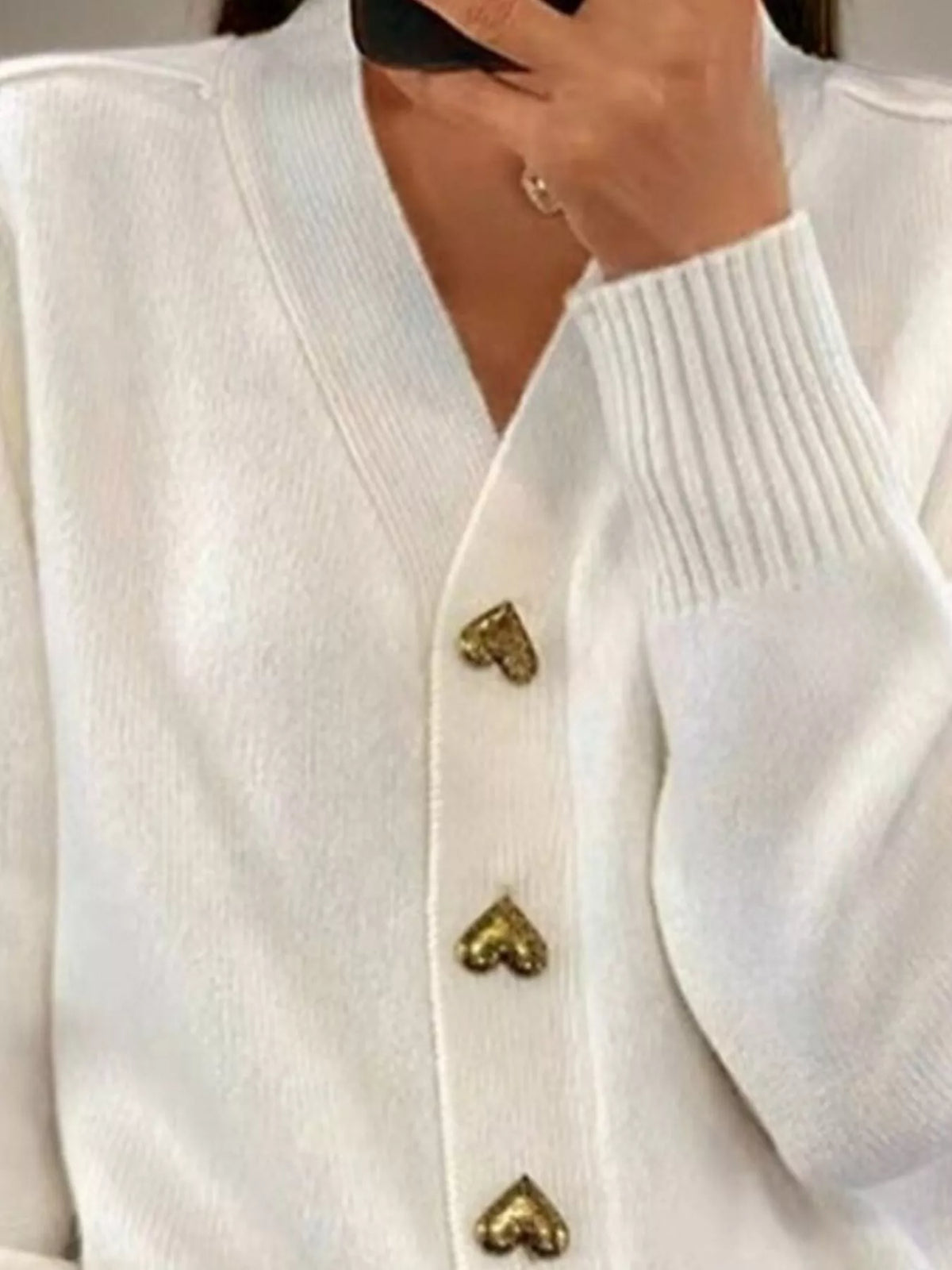 Women's V-Neck Cardigan with Gold Heart-Shaped Buttons in white — neckline detail view
