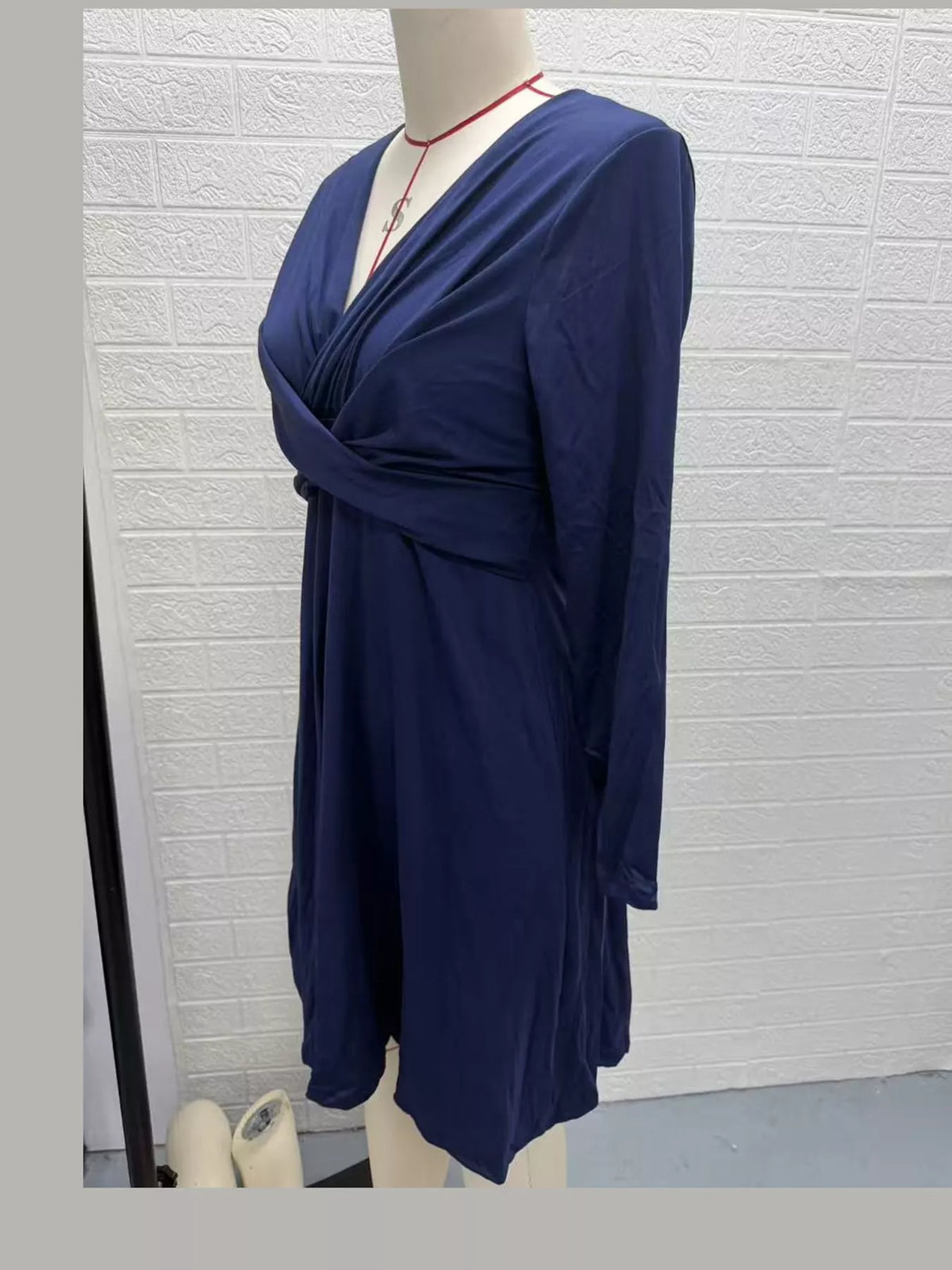 Navy long sleeve ruched-front midi dress, side view