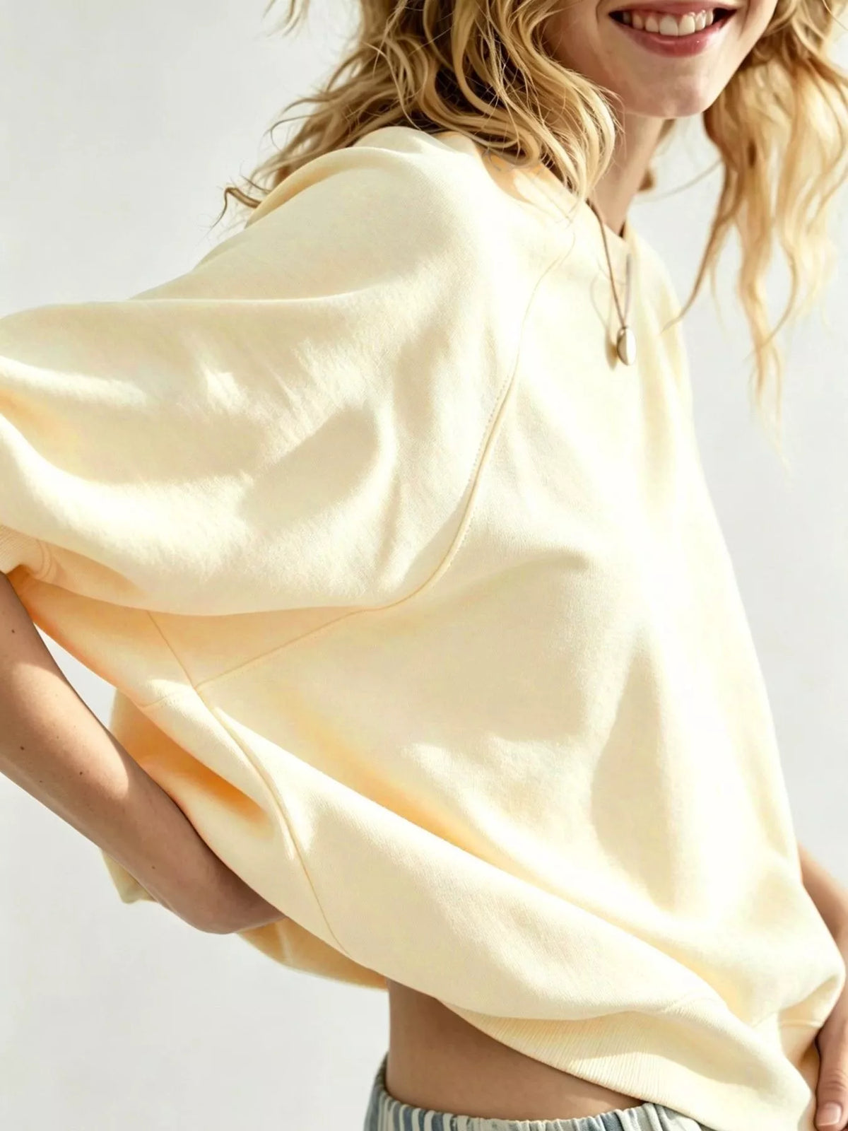 Women's Raglan Short-Sleeve Sweatshirt in cream — sleeve detail view
