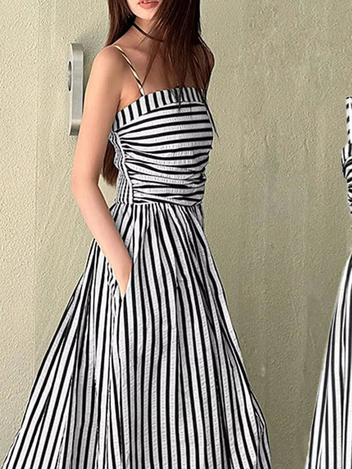 Black and white striped spaghetti strap maxi dress with gathered bodice and pockets