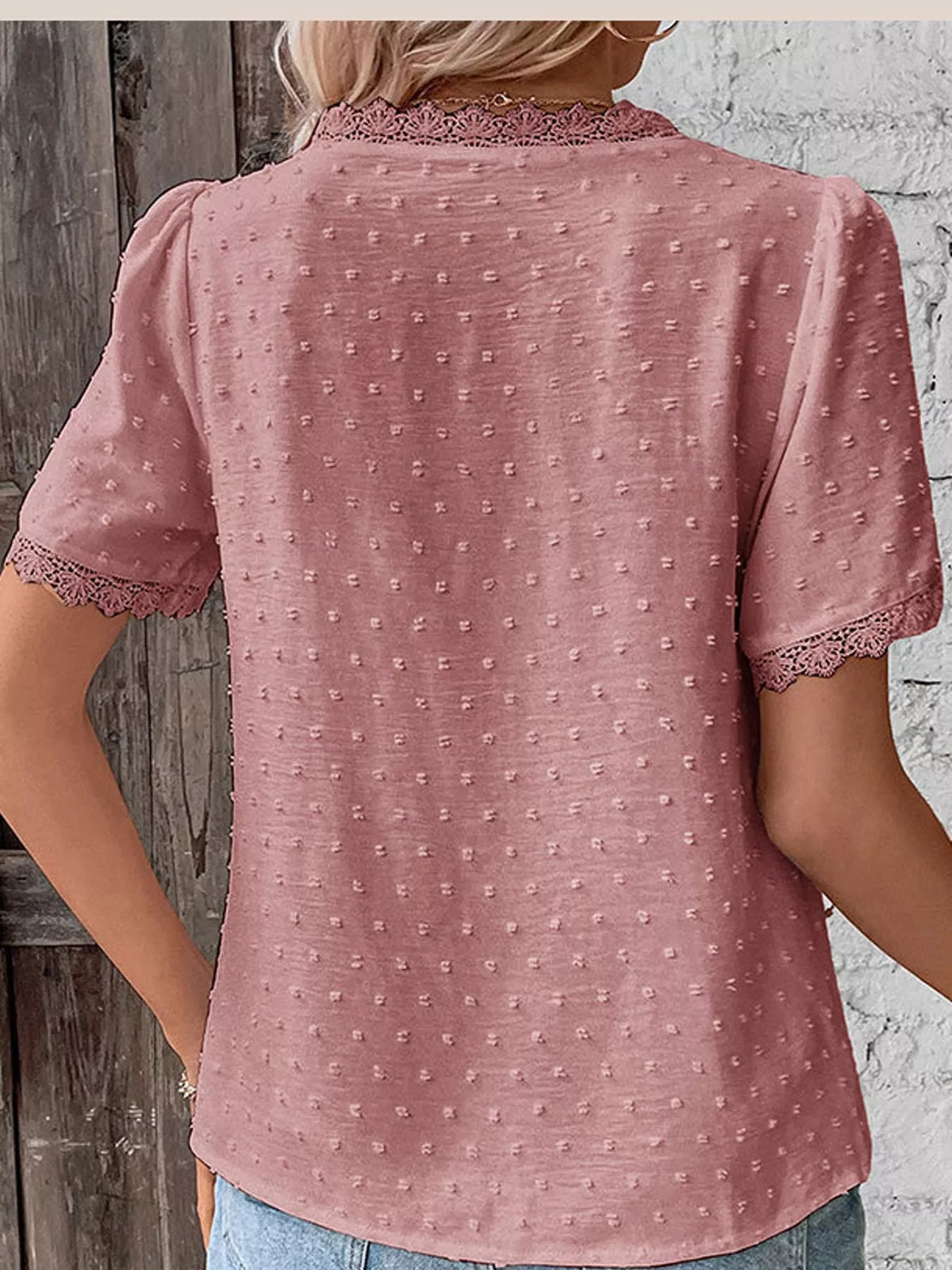 Pink swiss dot v-neck blouse with lace trim, back view