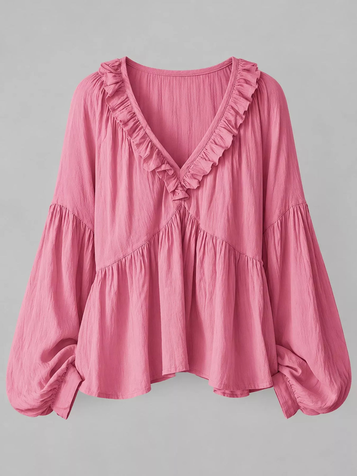 Pink ruffled v neck blouse, front view