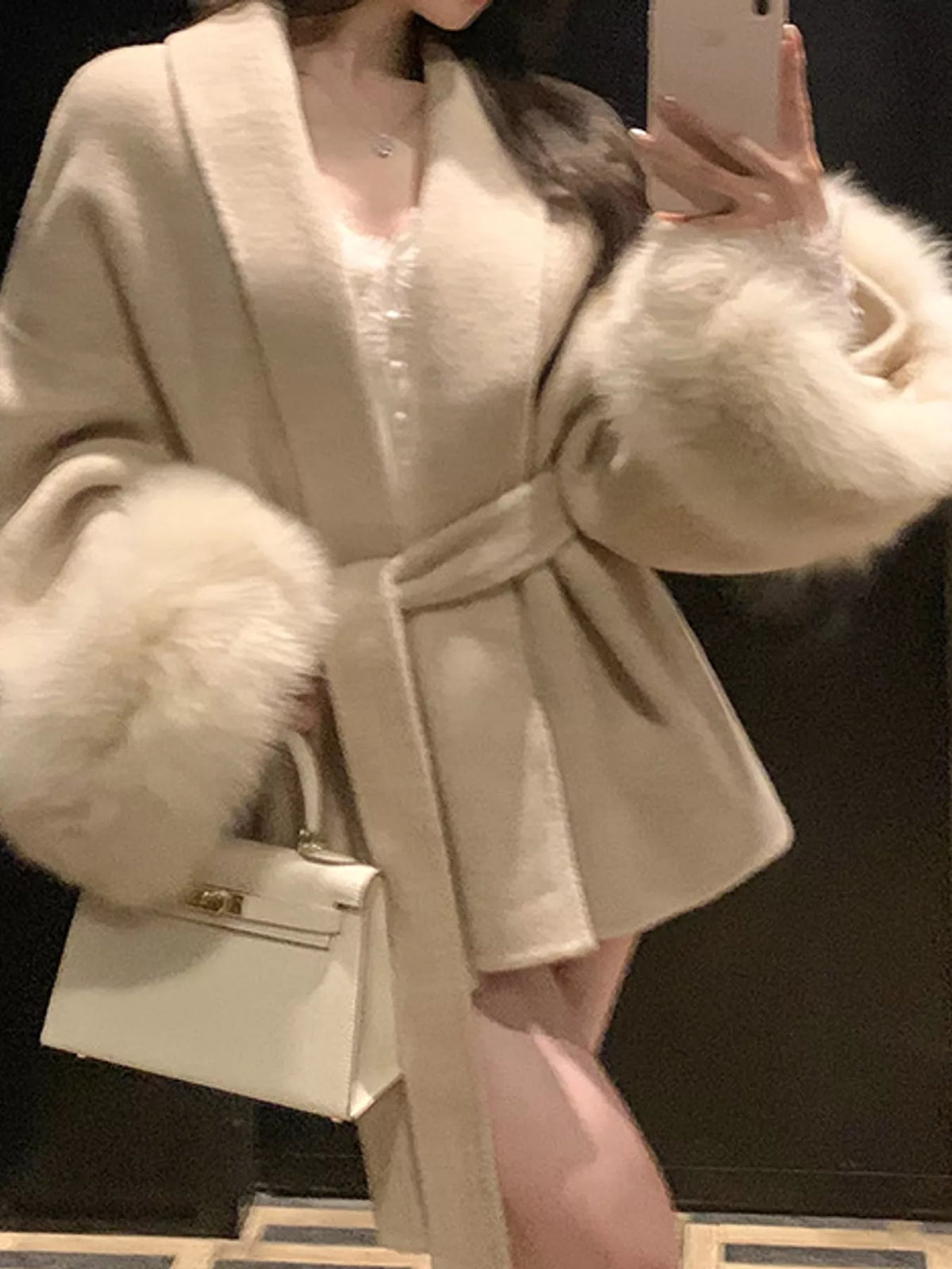 Cream tie-waist coat with faux fur cuffs — design and construction details