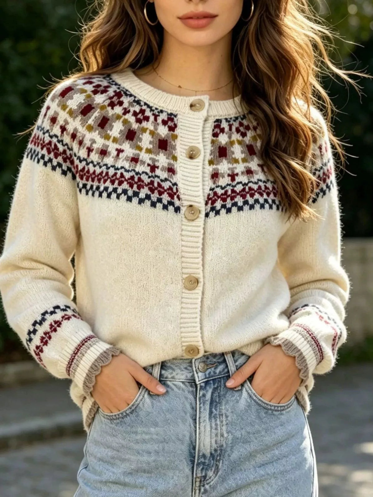 Cream fair isle button-front knit cardigan, front partially tucked.