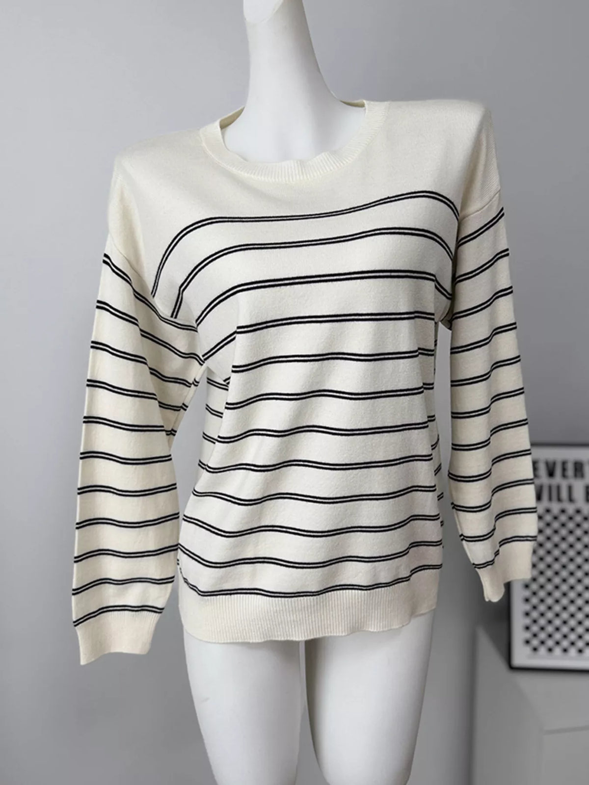 Striped crewneck sweater with layered tie detail in white and black, front without tie detail