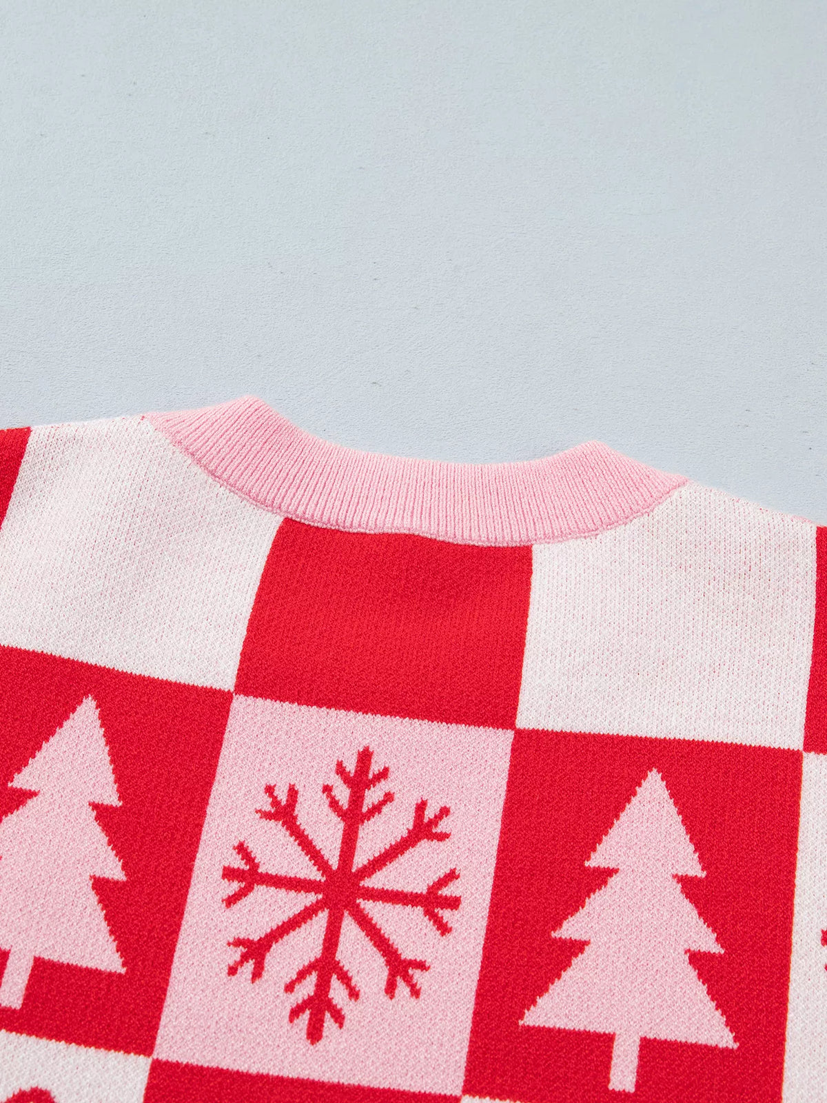 Christmas tree and snowflake motifs on pink and red christmas christmas patchwork round neck sweater