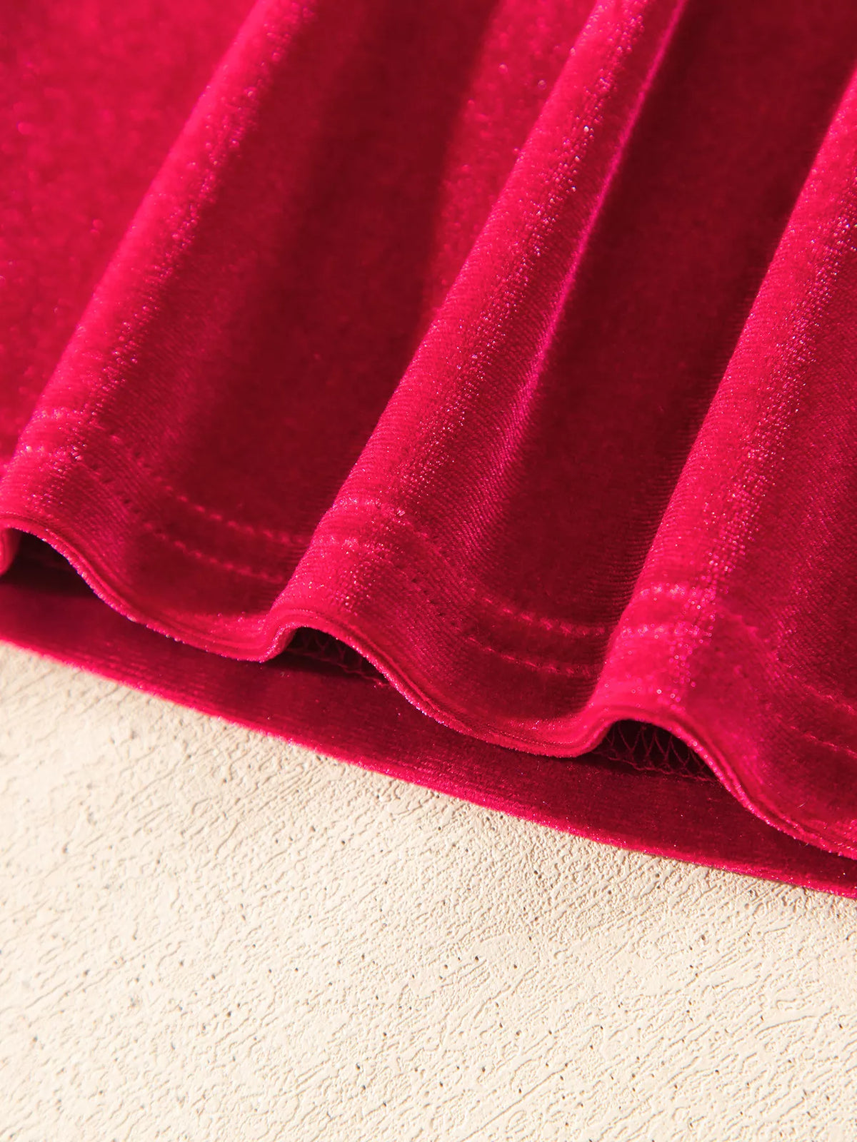 Hem stitching on red velvet button-down shirt with patch pockets