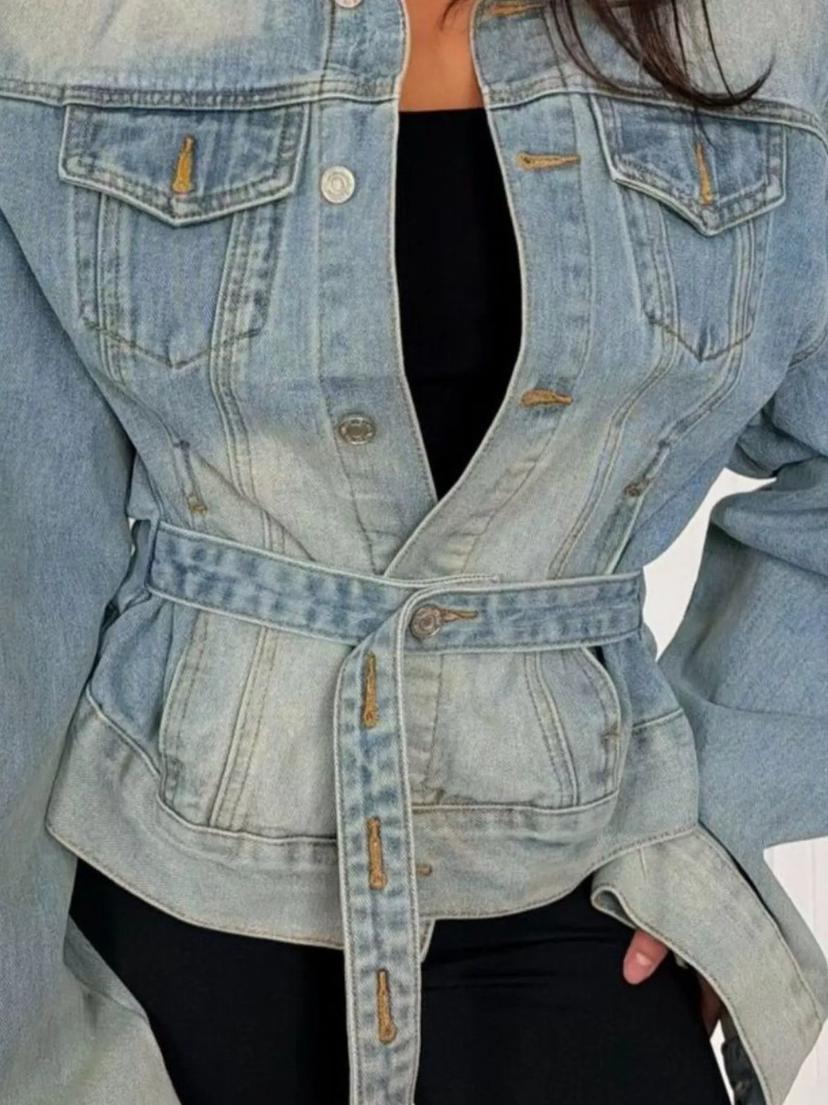 Light blue washed belted denim jacket, waist belt and flap pocket detail.