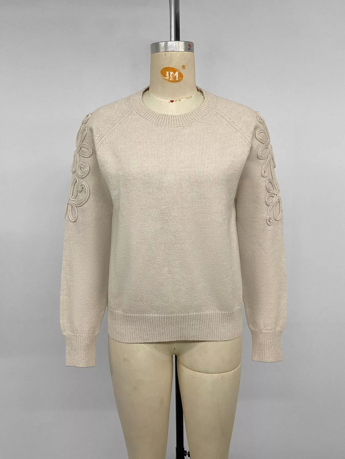 Cream floral raglan sleeve sweater, front on mannequin