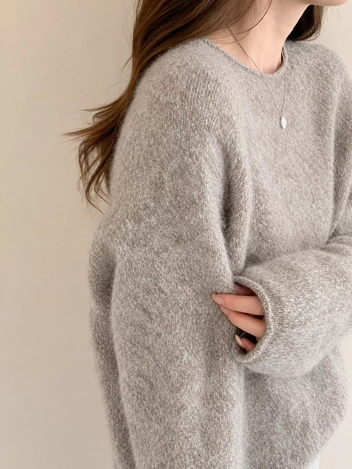 Round neck long sleeve sweater, side view